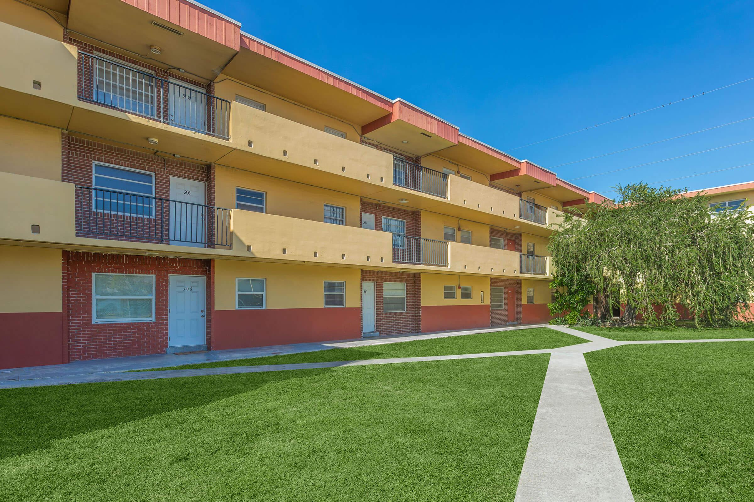 a large lawn in front of a building