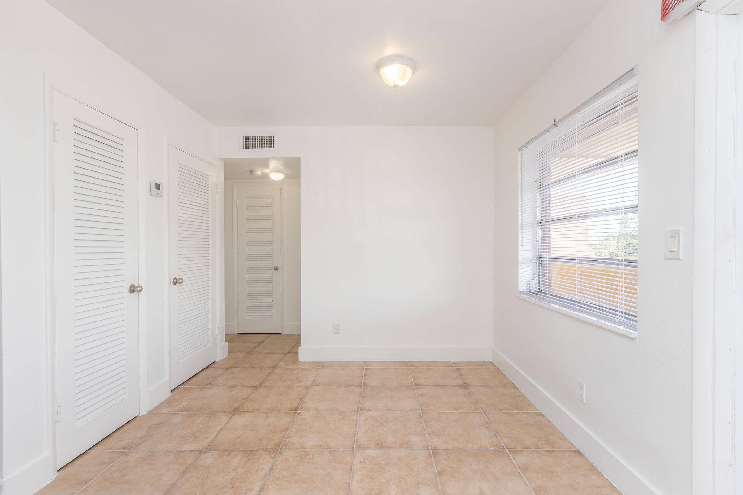 a kitchen with a tile floor