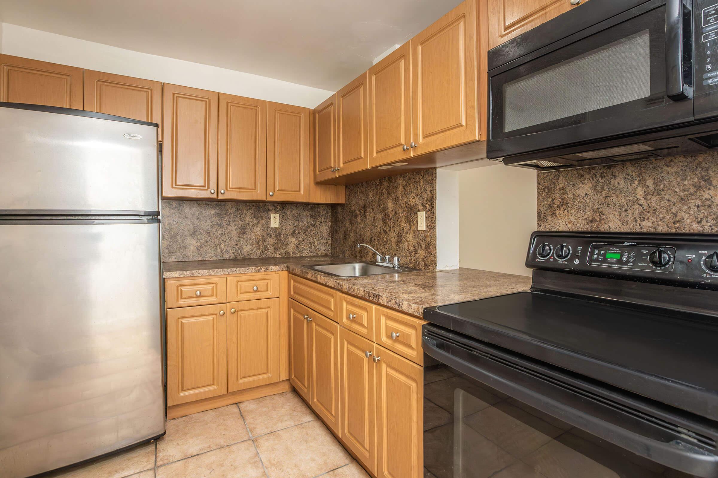 a stainless steel refrigerator in a kitchen