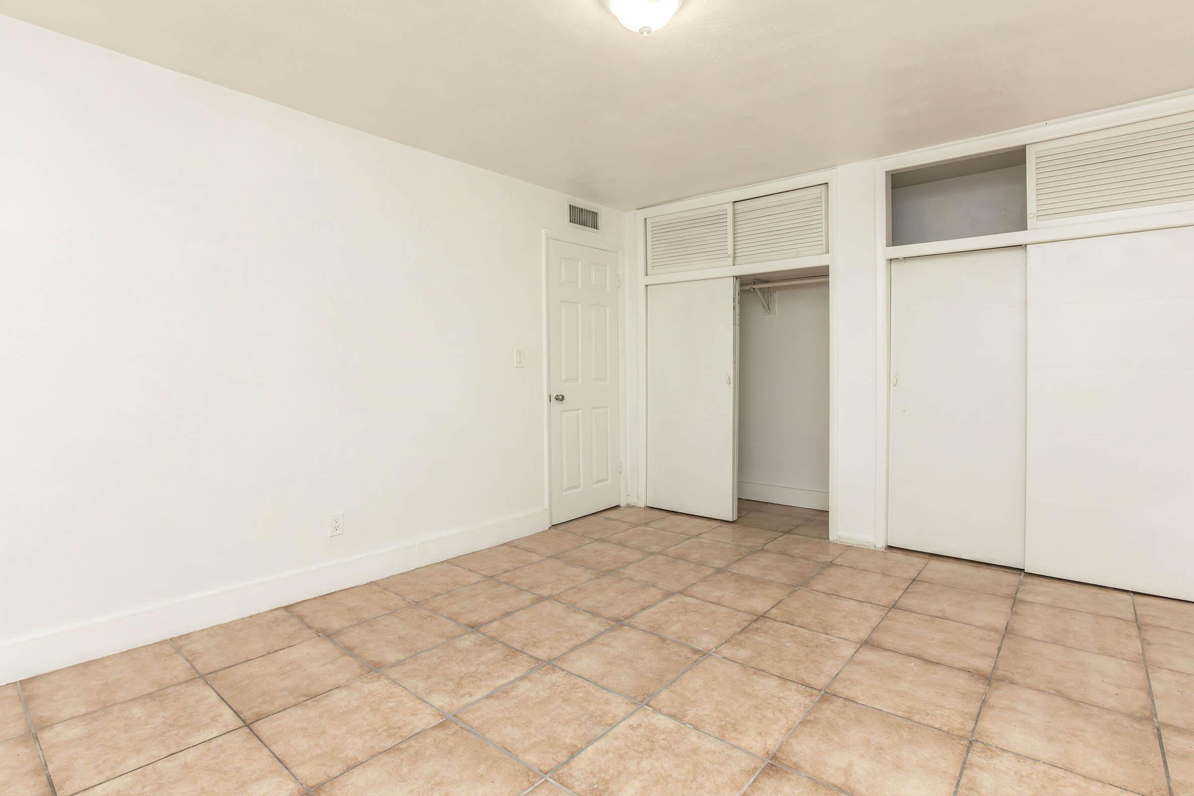 a kitchen with a tile floor