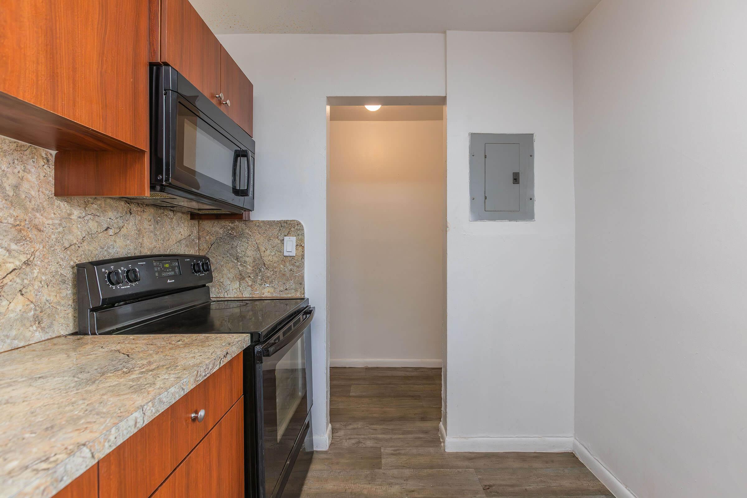 a kitchen with a stove and a refrigerator