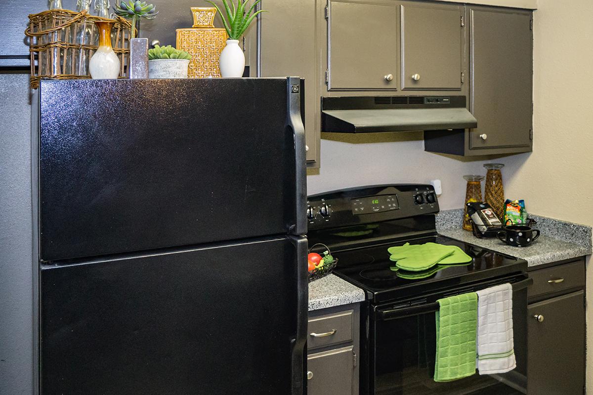 a kitchen with a stove top oven sitting inside of a refrigerator