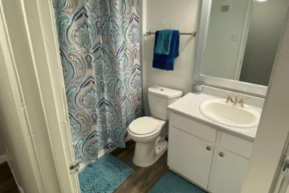 a room with a sink and a mirror