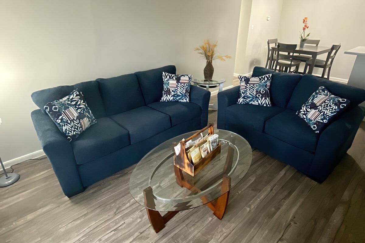 a brown leather couch in a living room