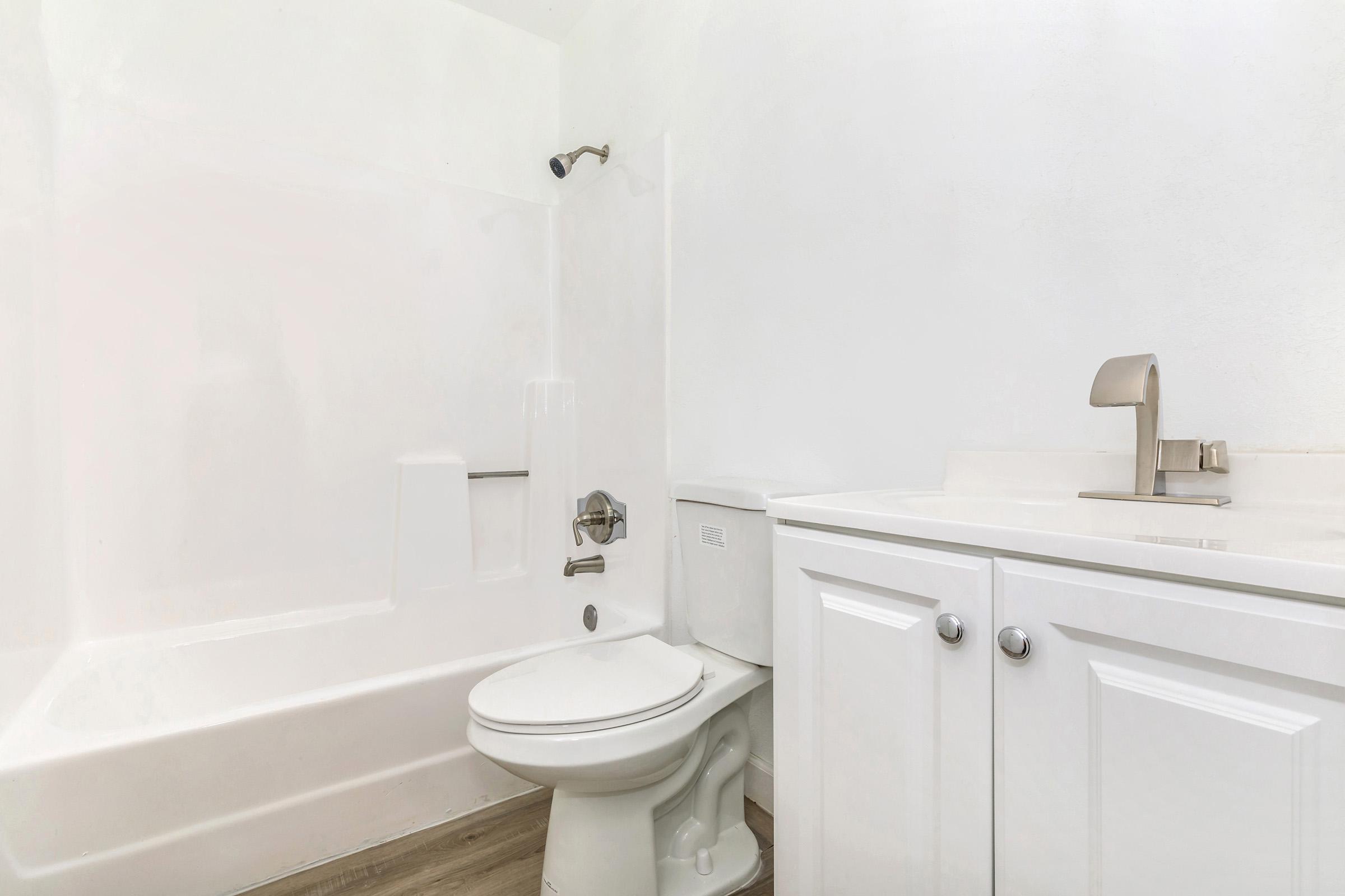 a room with a sink and a shower