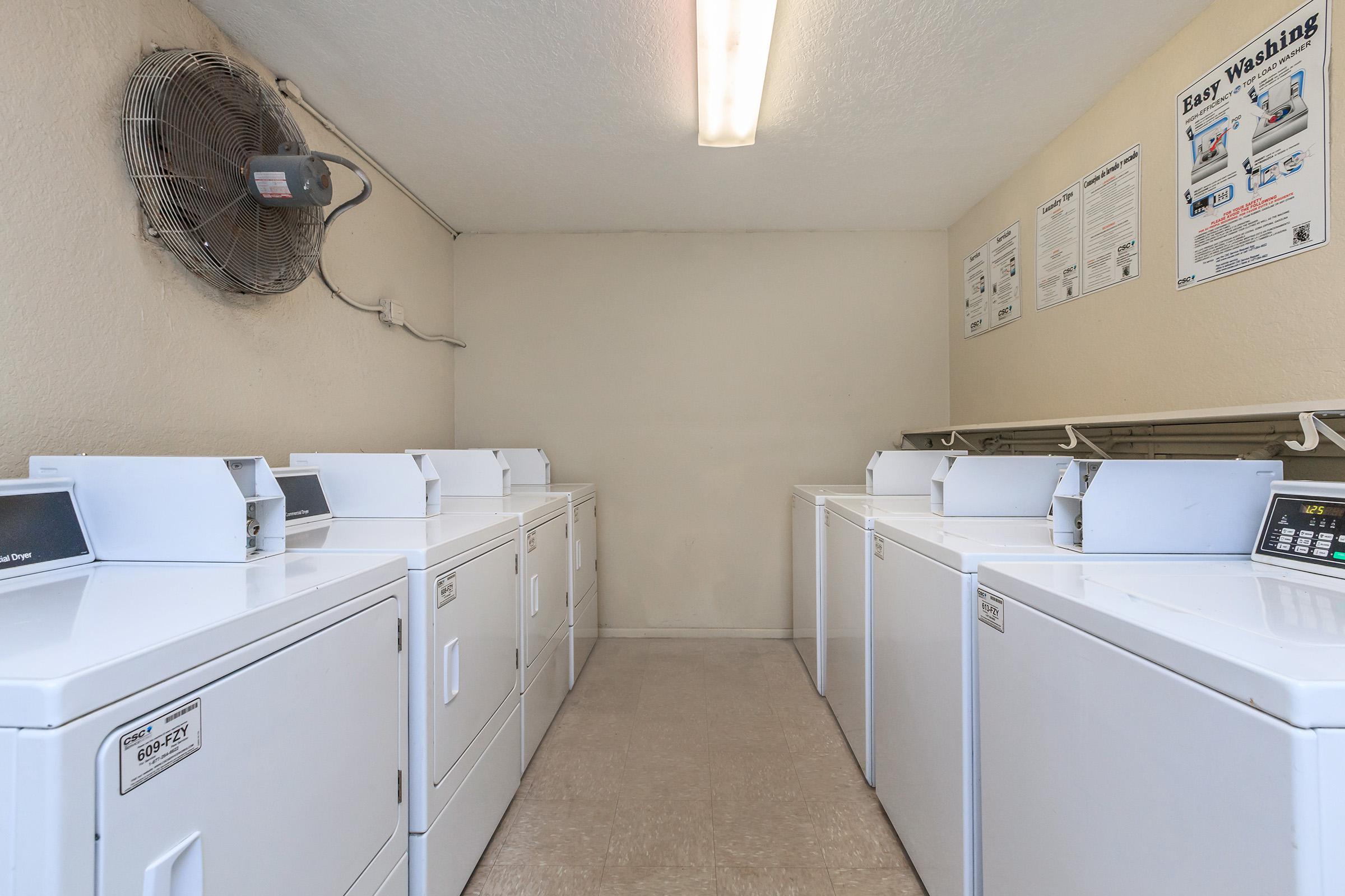 a kitchen with a sink and a refrigerator