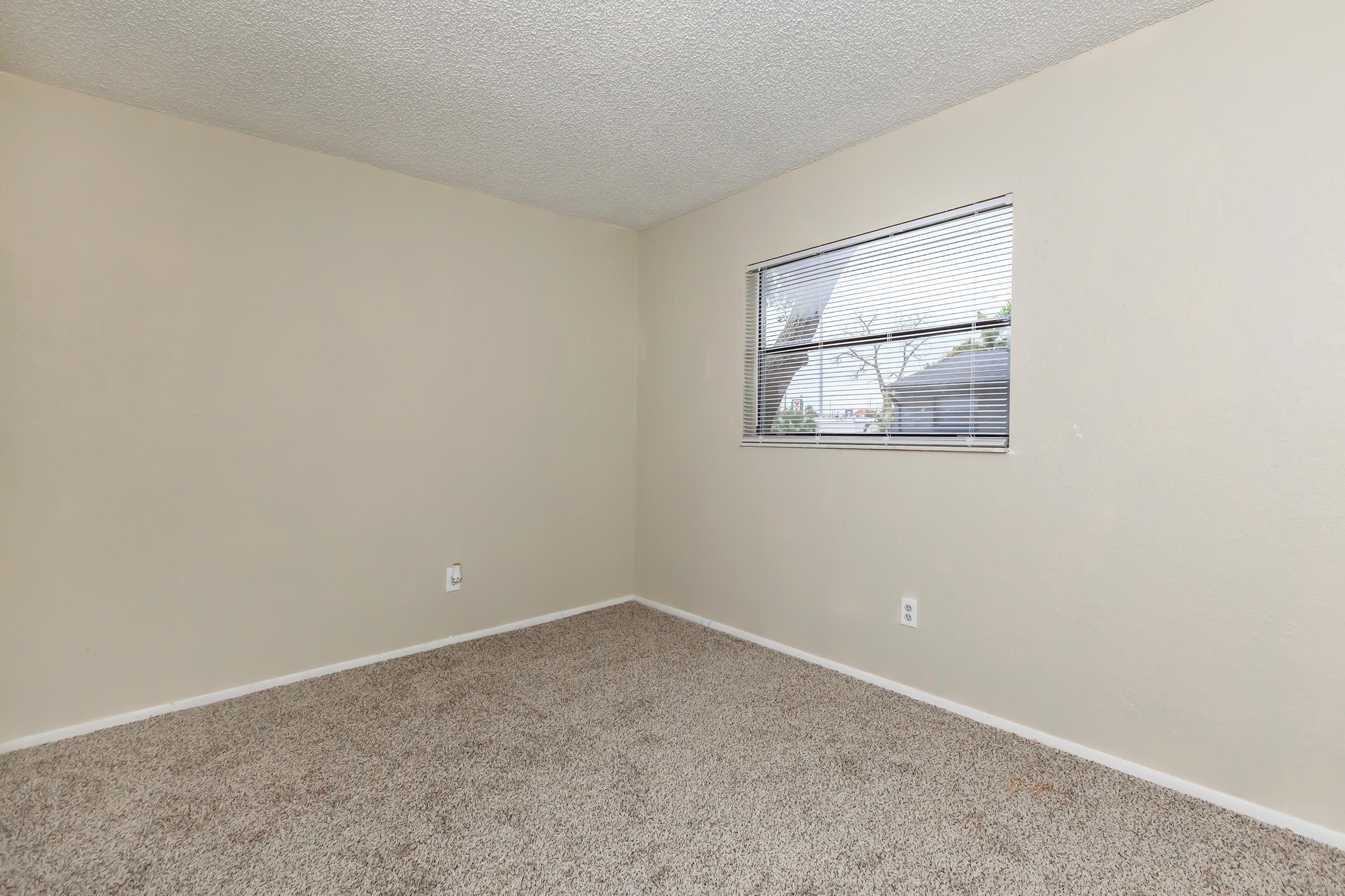 a bedroom with a large mirror