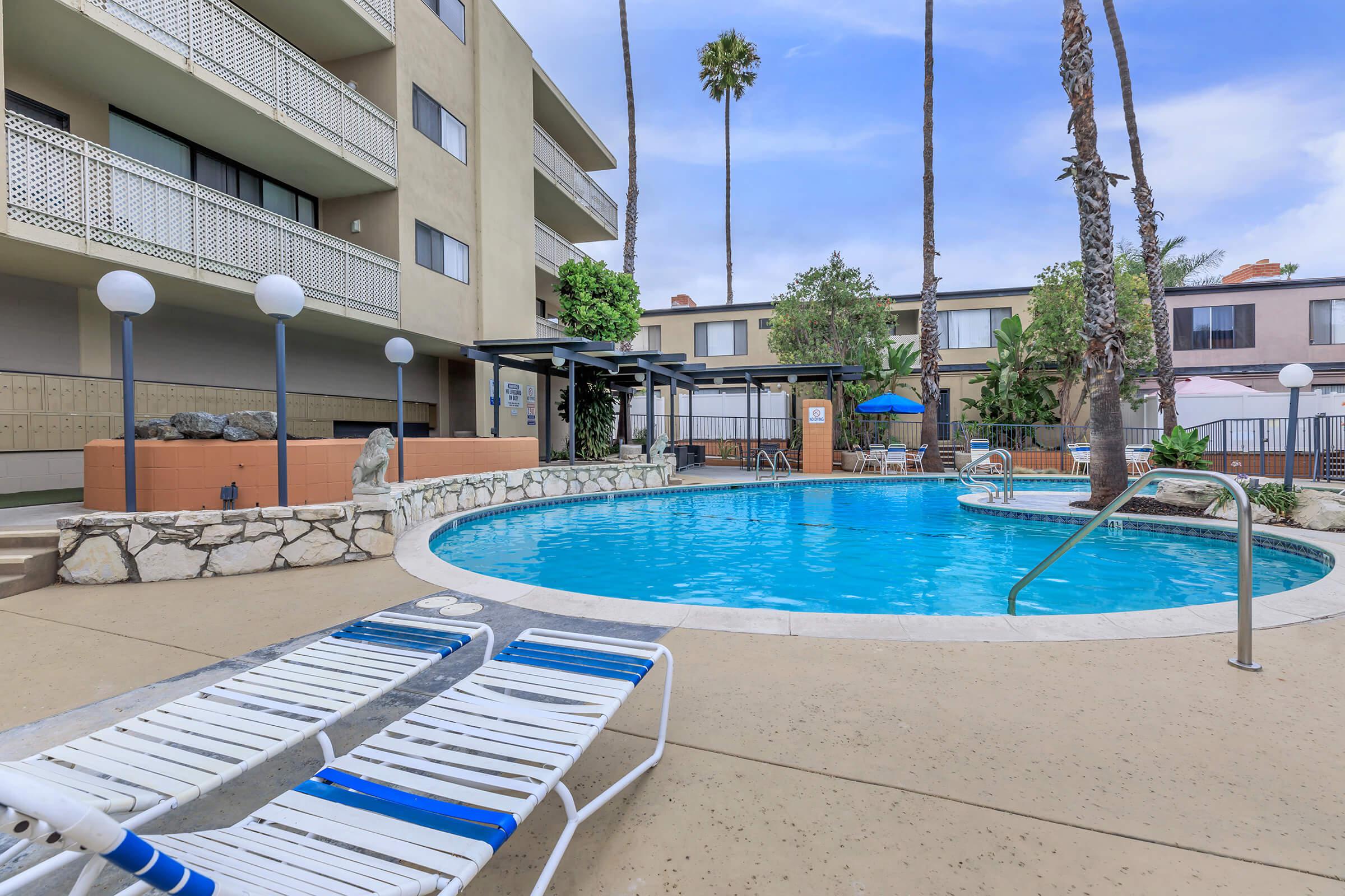 A community pool with chairs