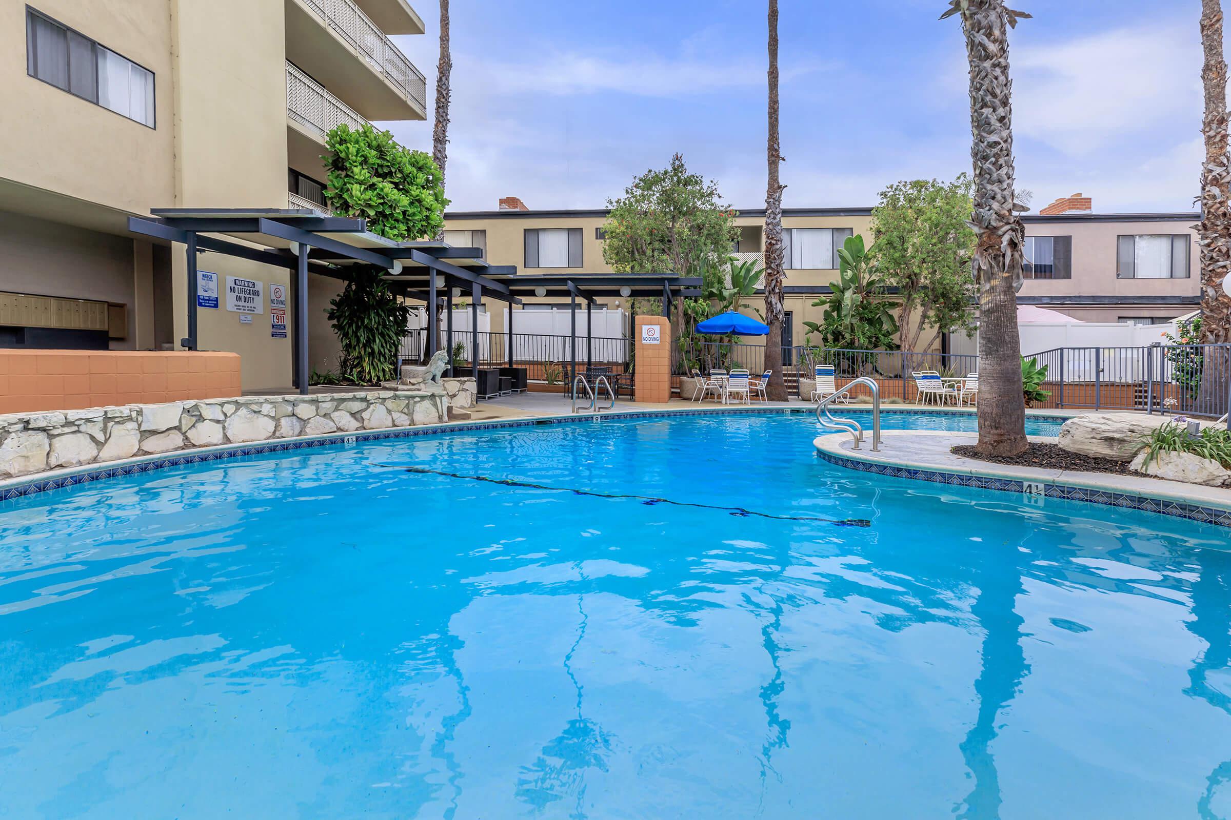 Newton Towers community pool with green trees