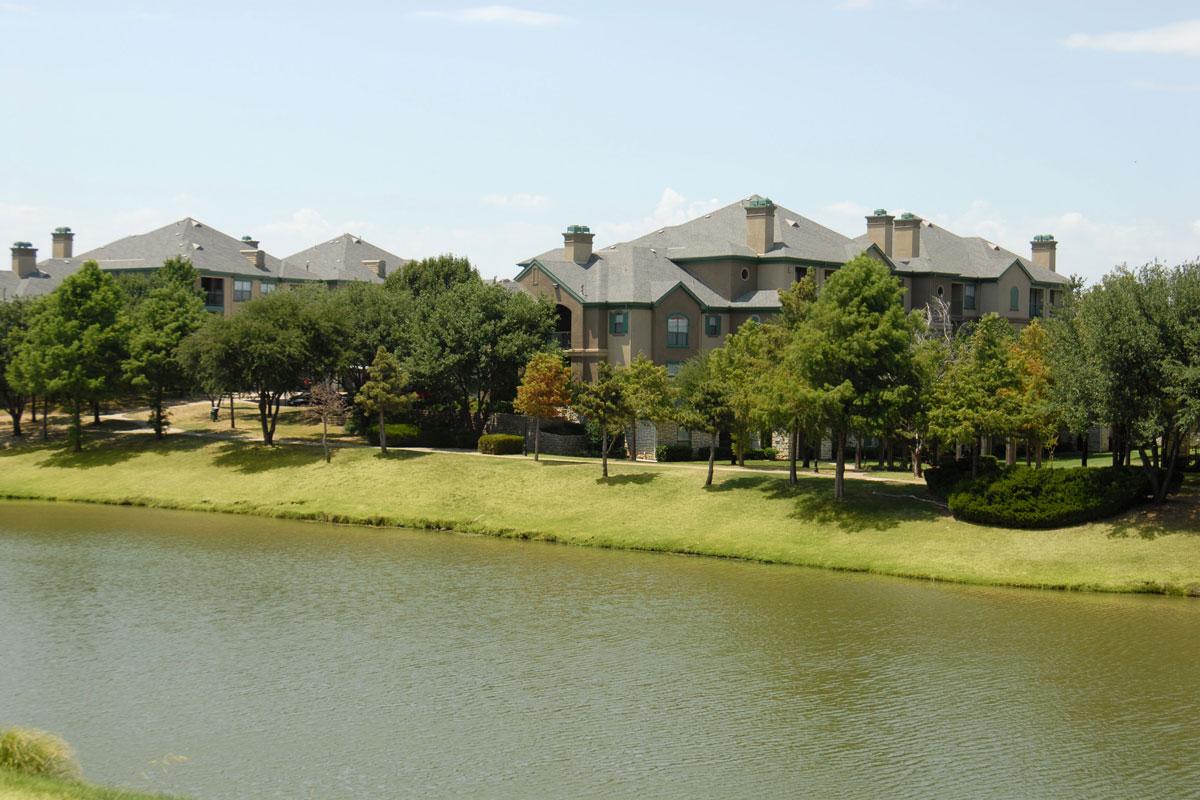 a house next to a body of water