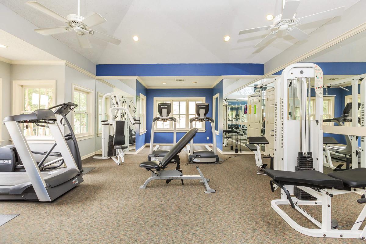 a room filled with furniture and a blue chair