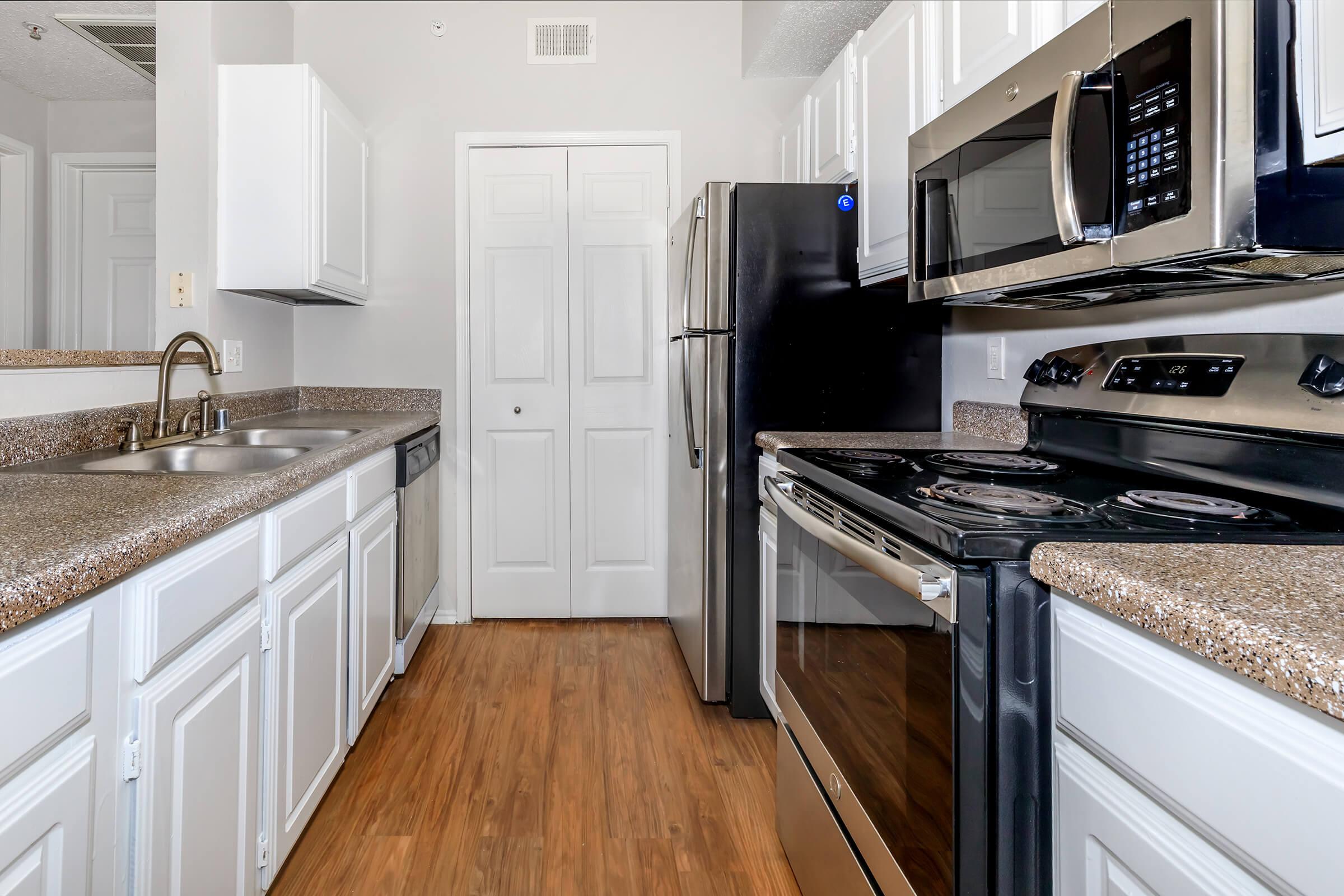 a modern kitchen with stainless steel appliances