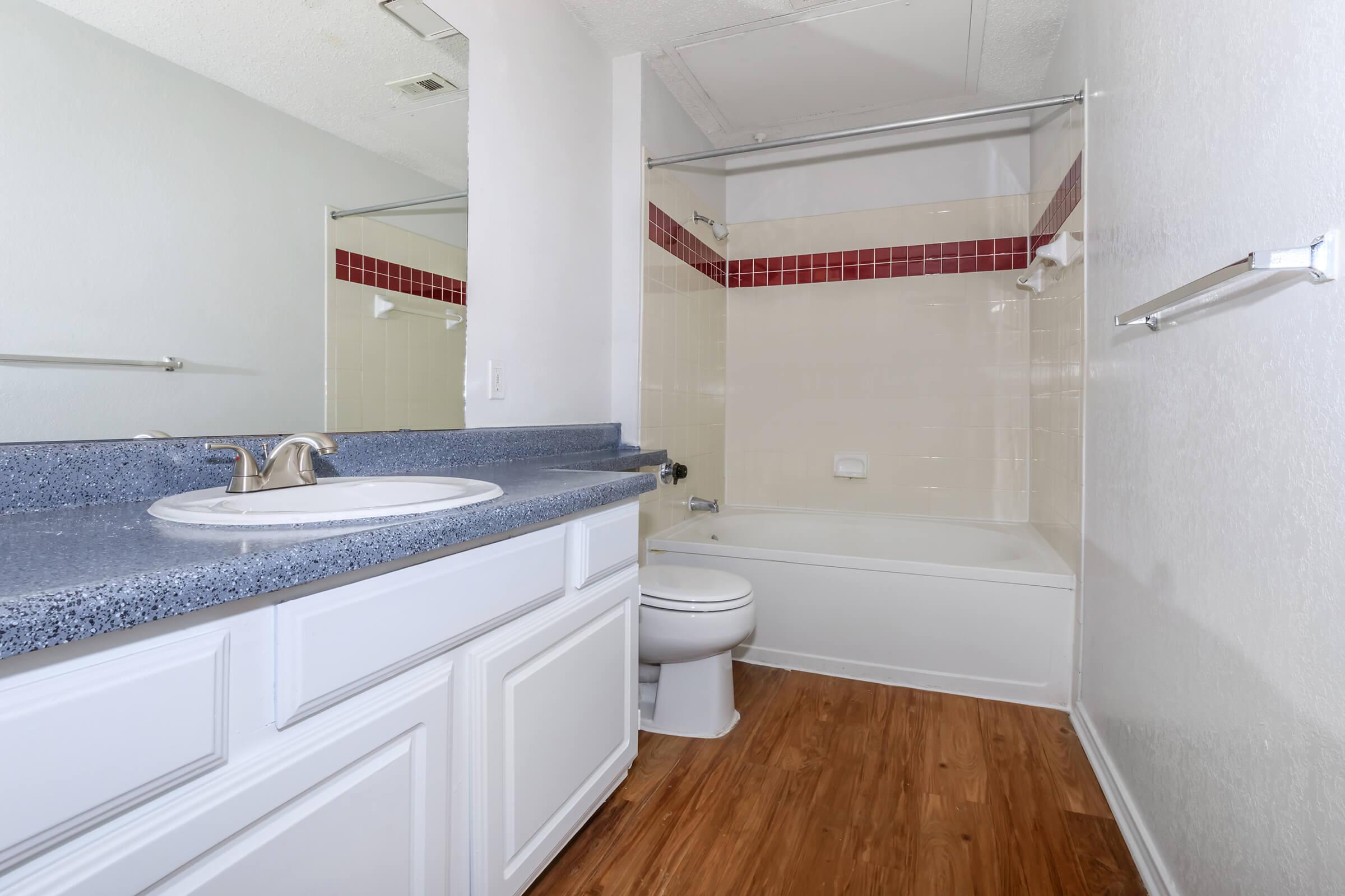 a kitchen with a sink and a mirror