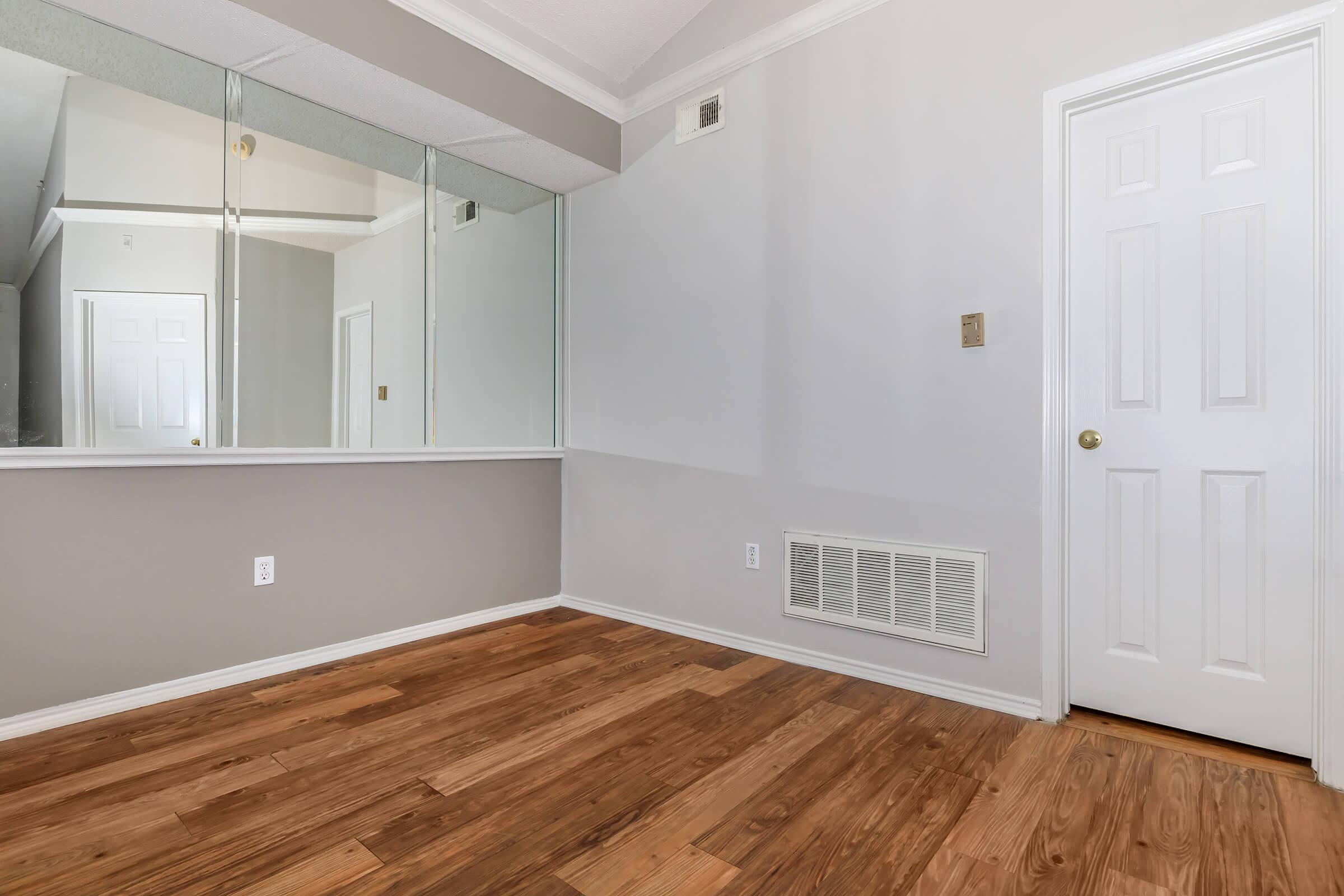 a kitchen with a wood floor