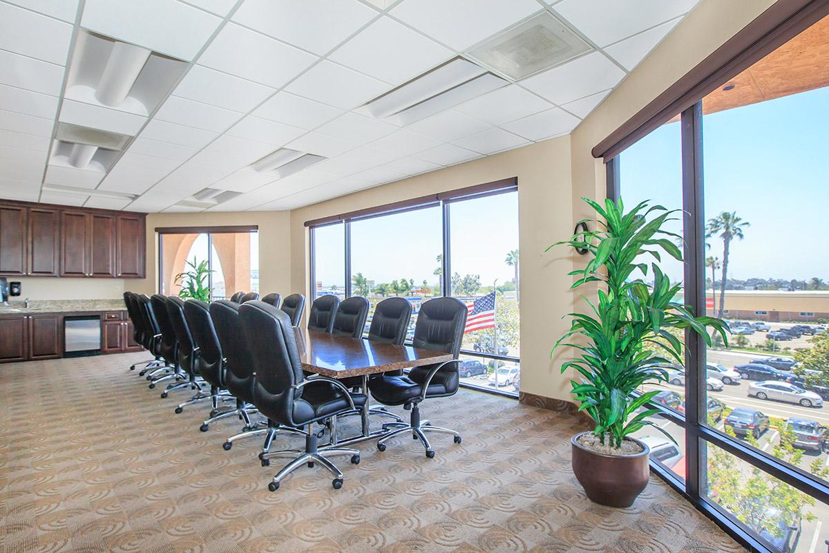 a room filled with furniture and a large window