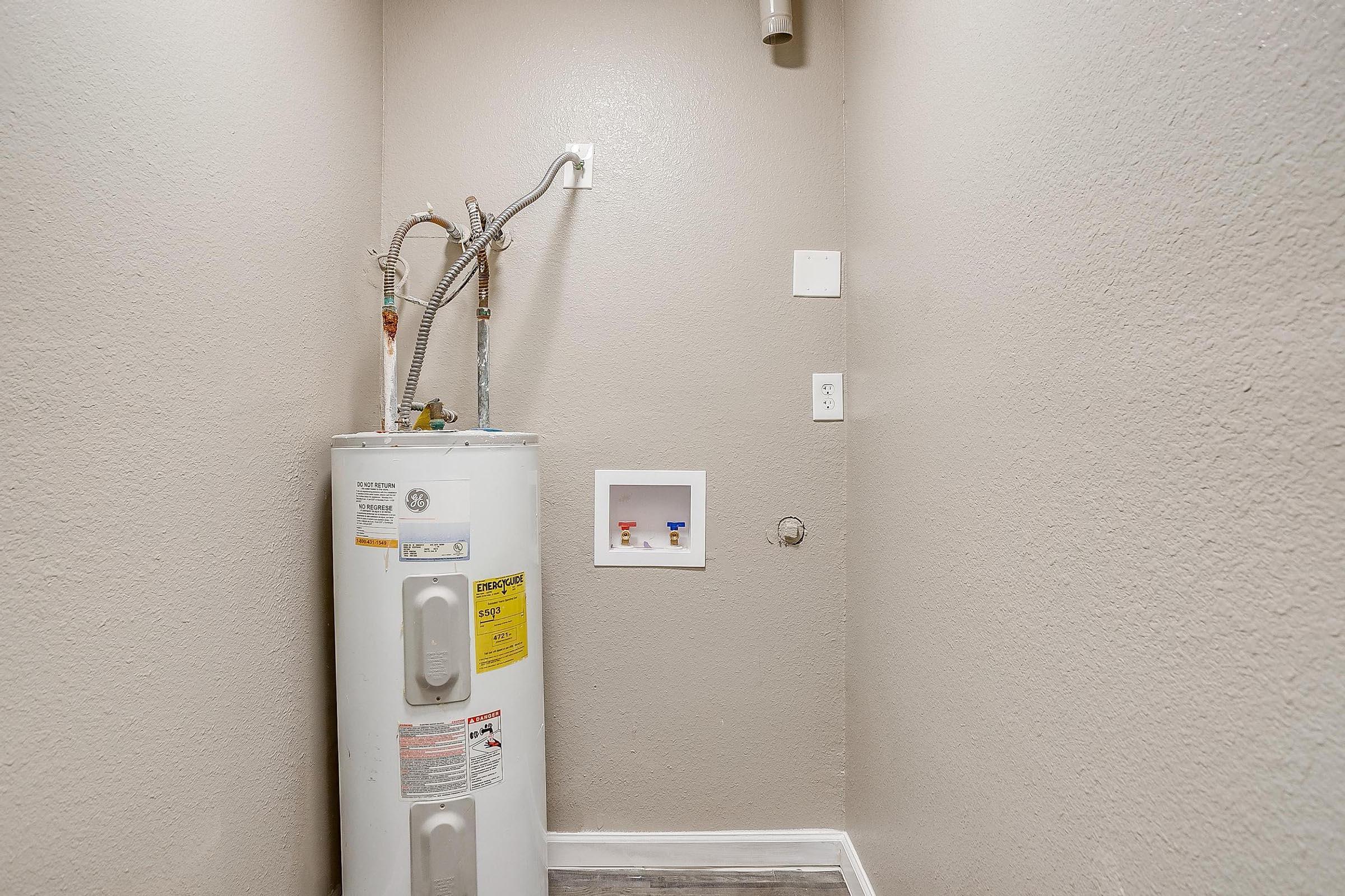 a refrigerator freezer sitting inside of a building