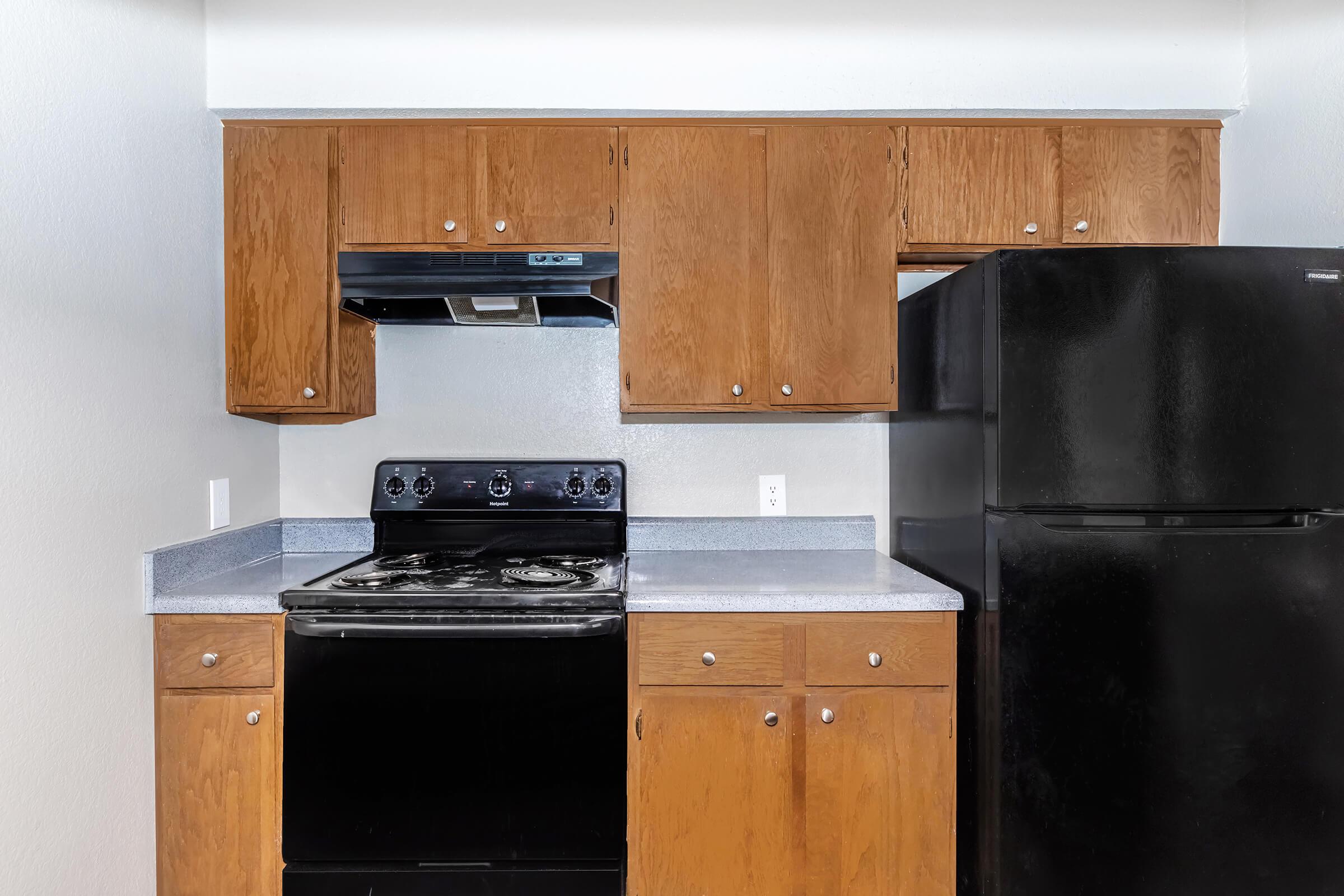 a kitchen with a stove top oven sitting inside of a refrigerator