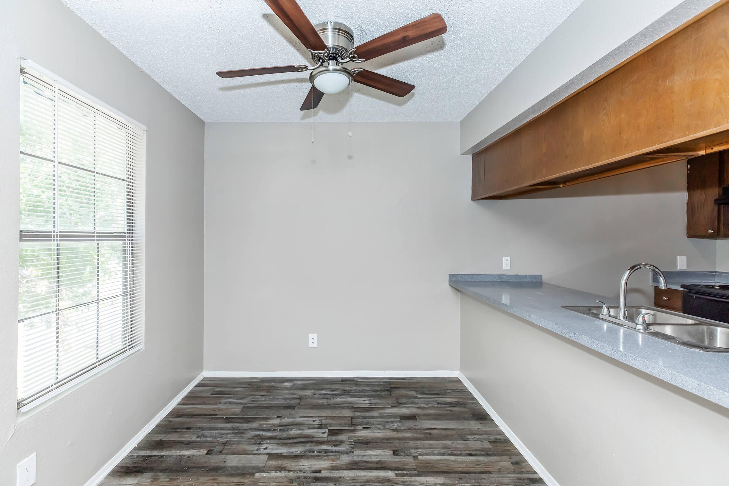 a kitchen with a sink and a window