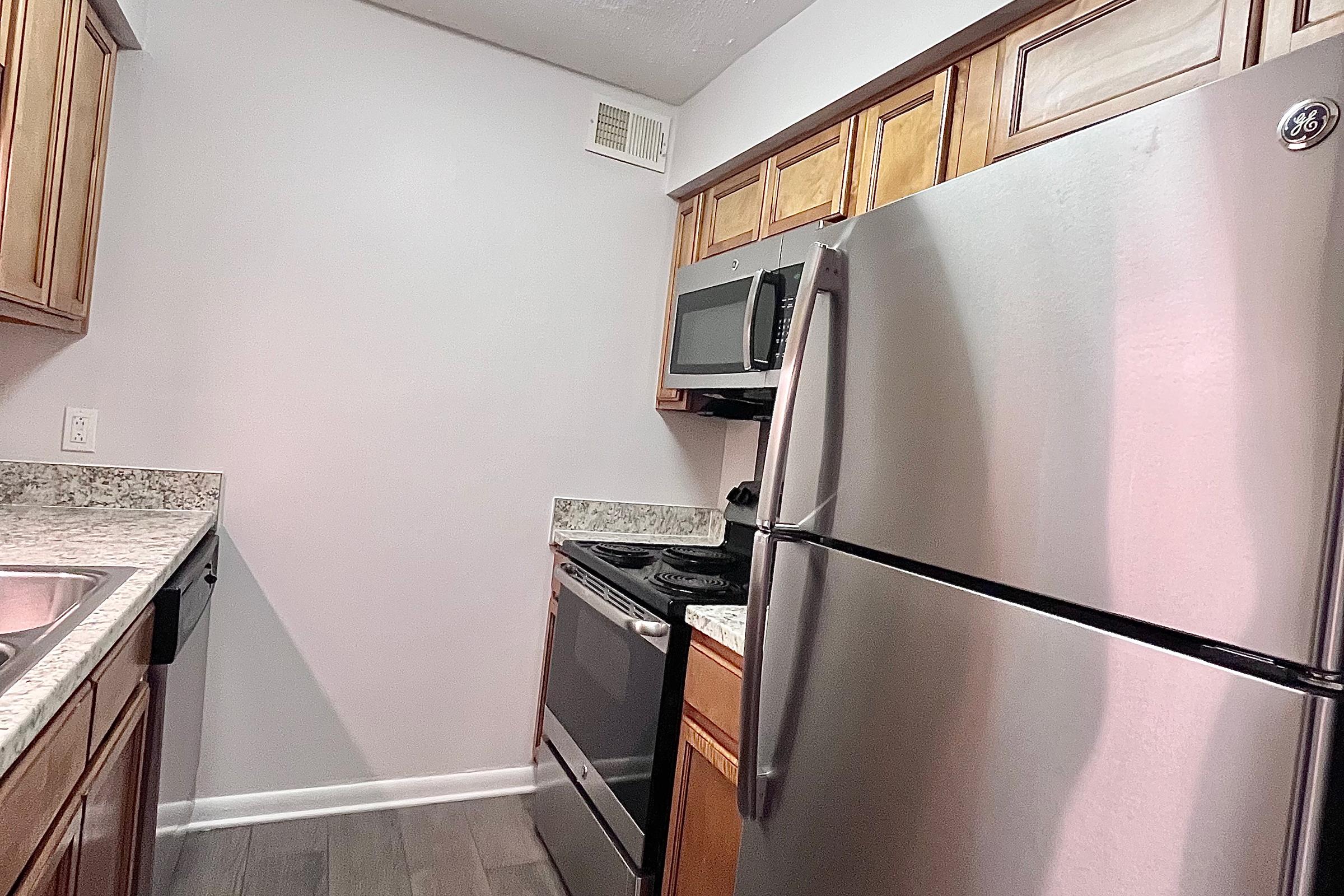 a stainless steel refrigerator in a kitchen