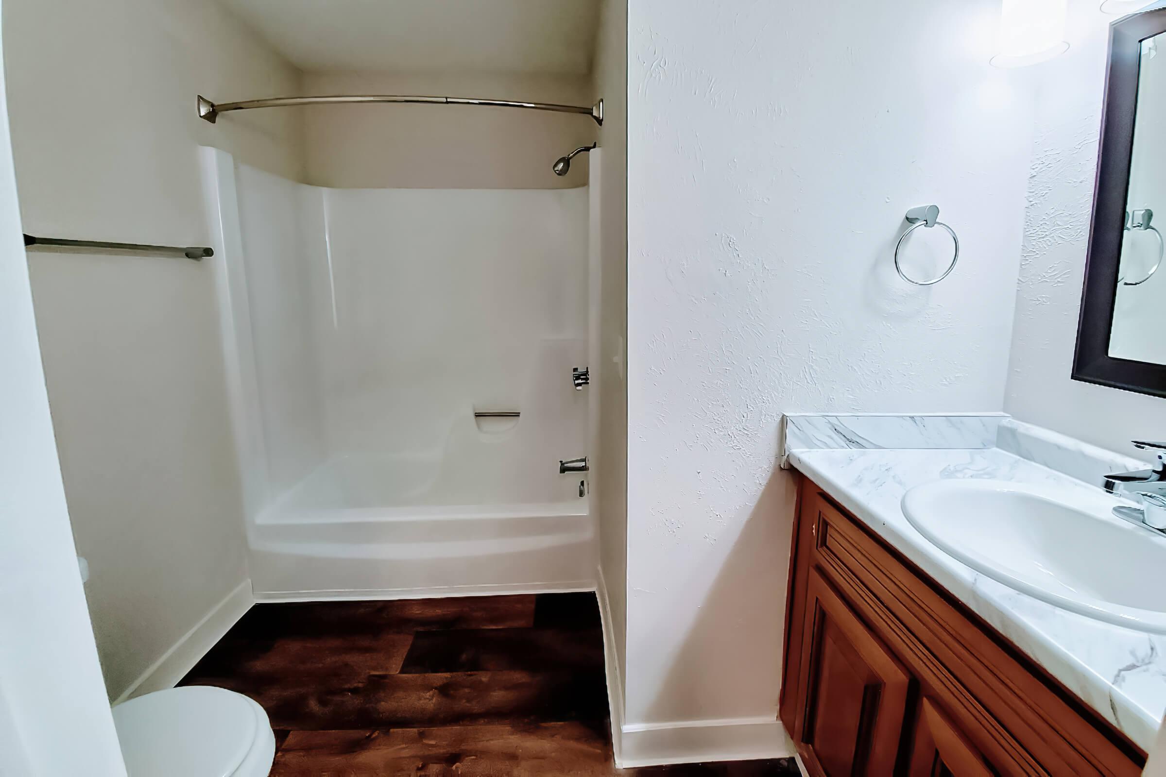 a room with a sink and a shower