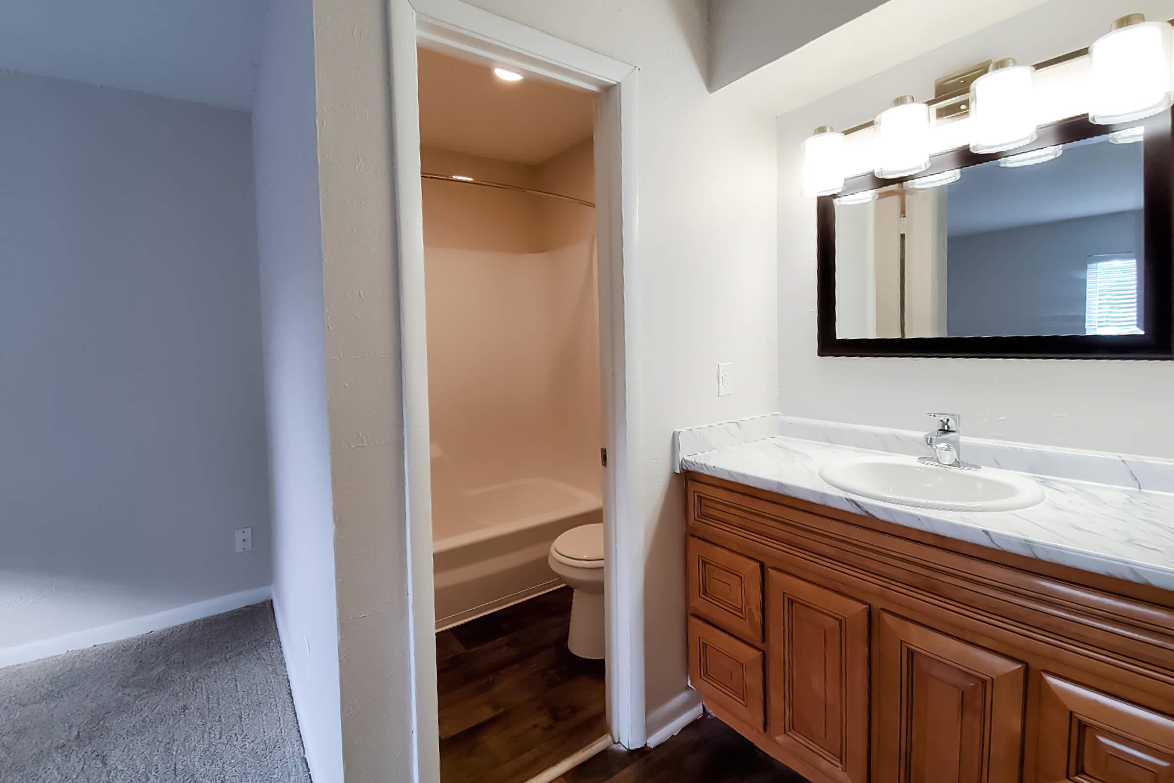 a bedroom with a large mirror