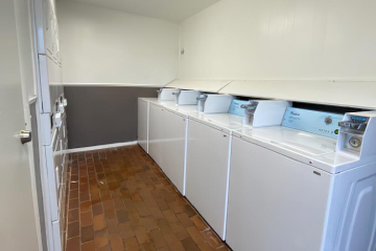 a kitchen with a sink and a refrigerator