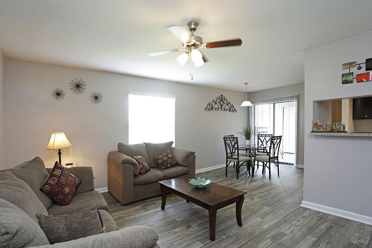 a living room filled with furniture and a table