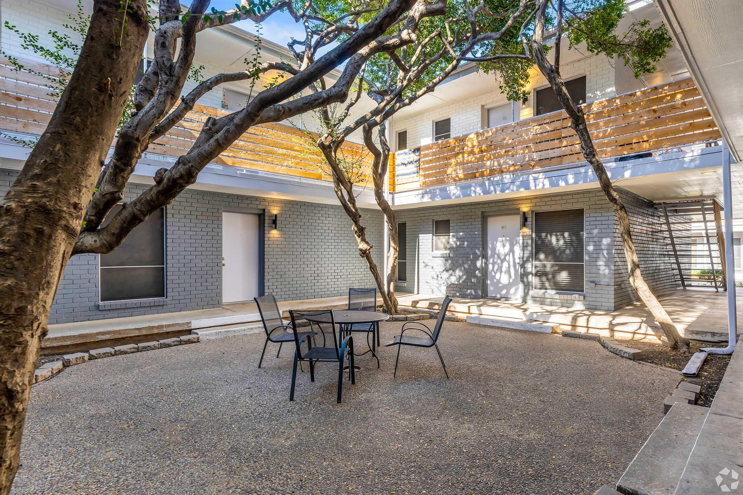 a tree in front of a building