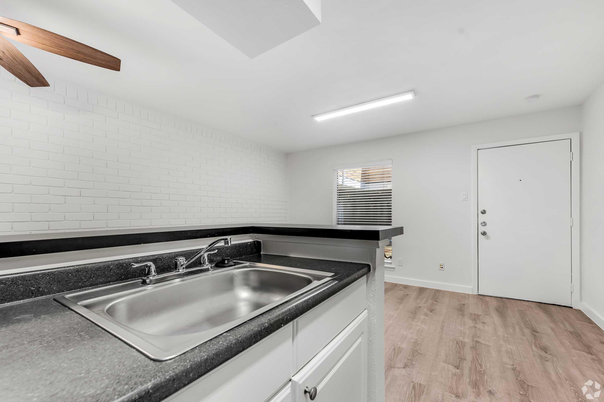 a stove top oven sitting inside of a kitchen