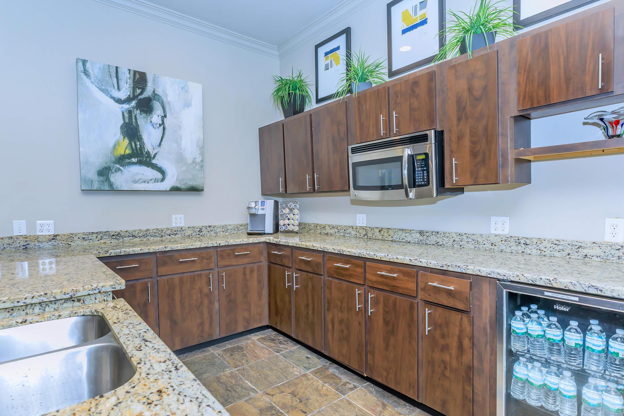 a kitchen with wooden cabinets