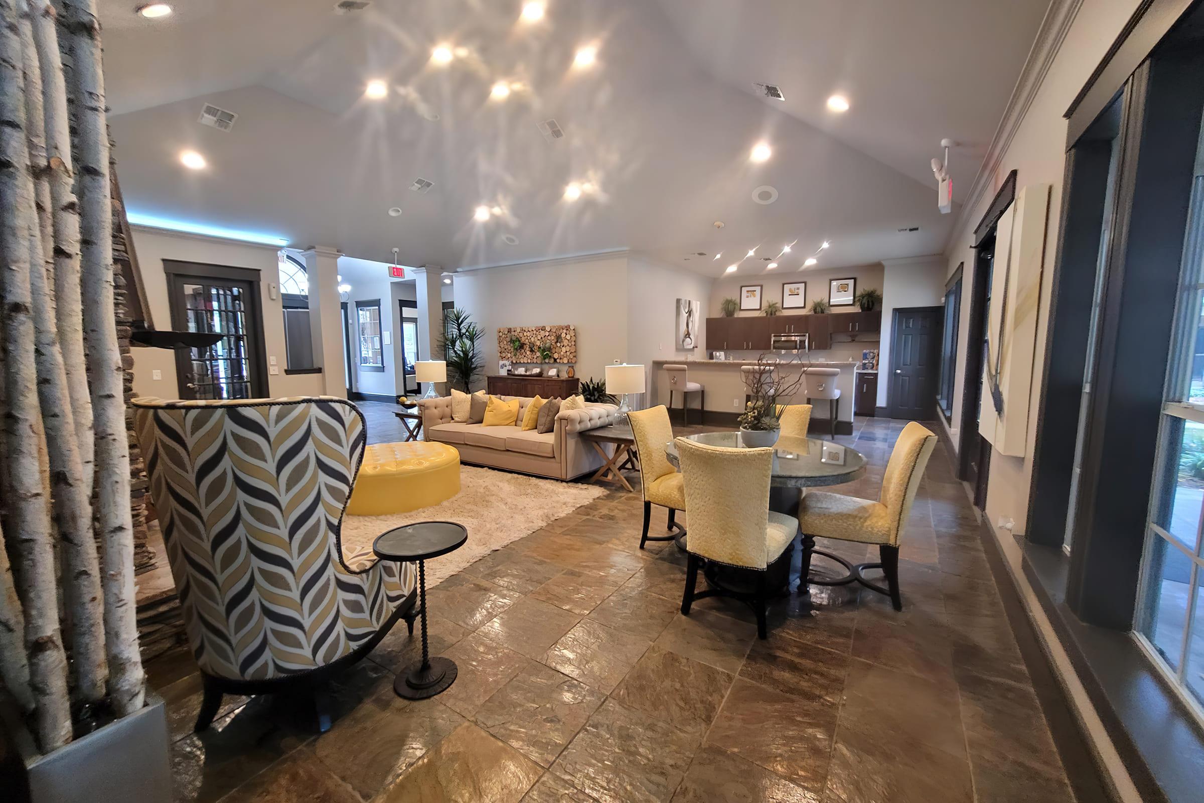 a living room filled with furniture and a fireplace