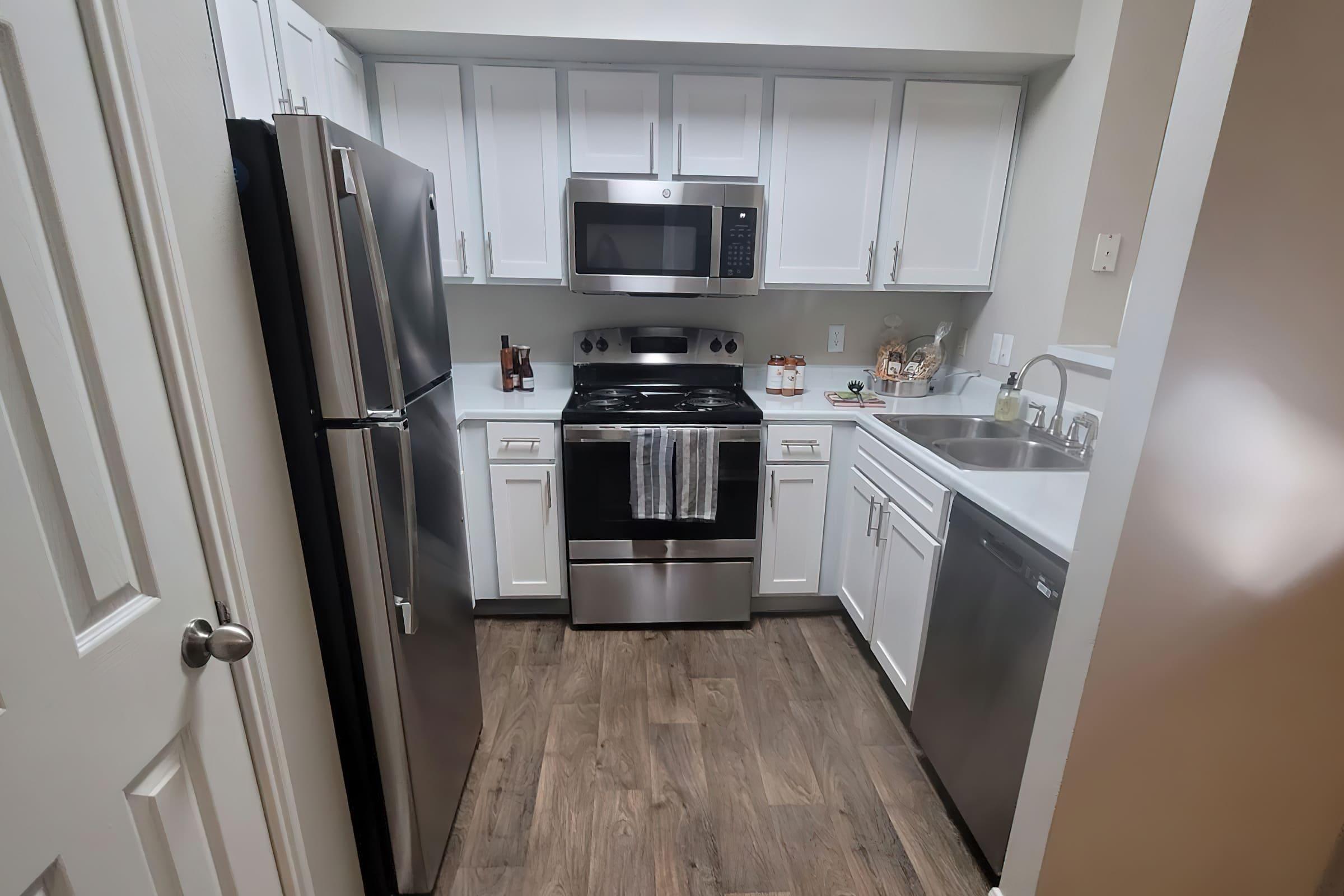 a kitchen with a stove and a sink