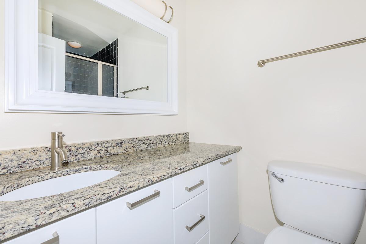 a room with a sink and a mirror