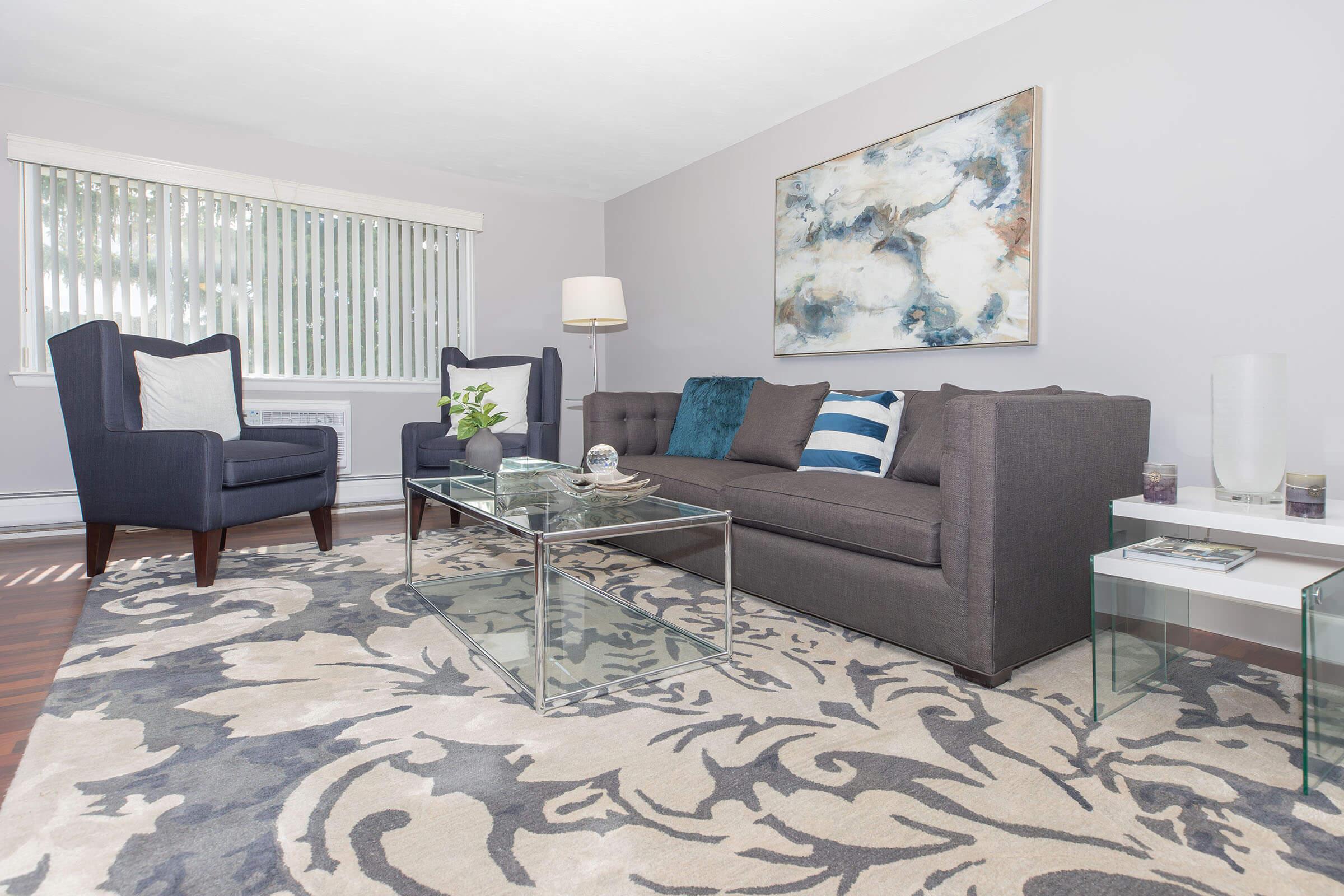 a living room filled with furniture and a flat screen tv