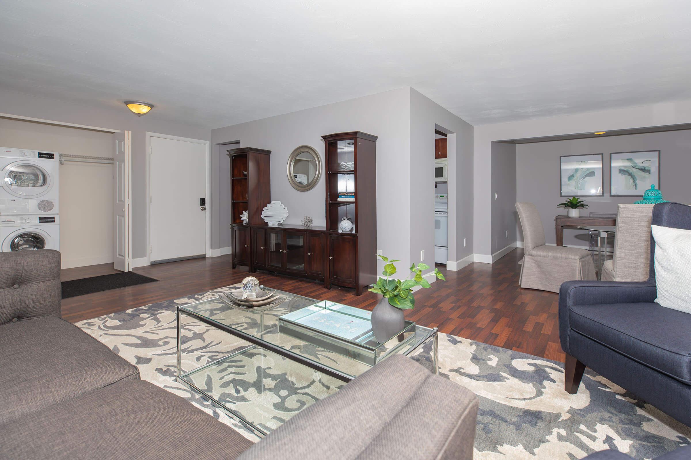 a living room filled with furniture and a flat screen tv