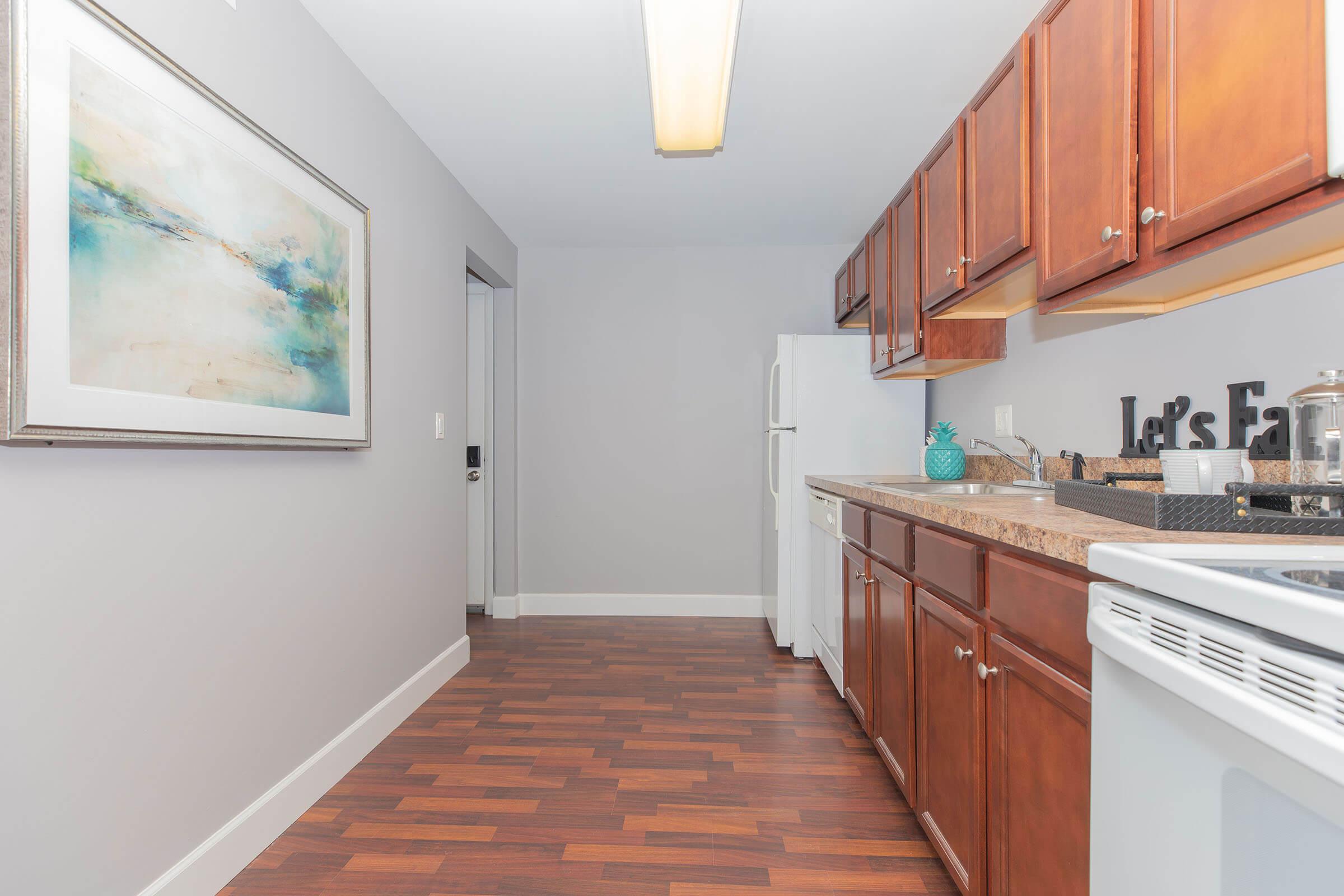 a kitchen with a stove and a refrigerator