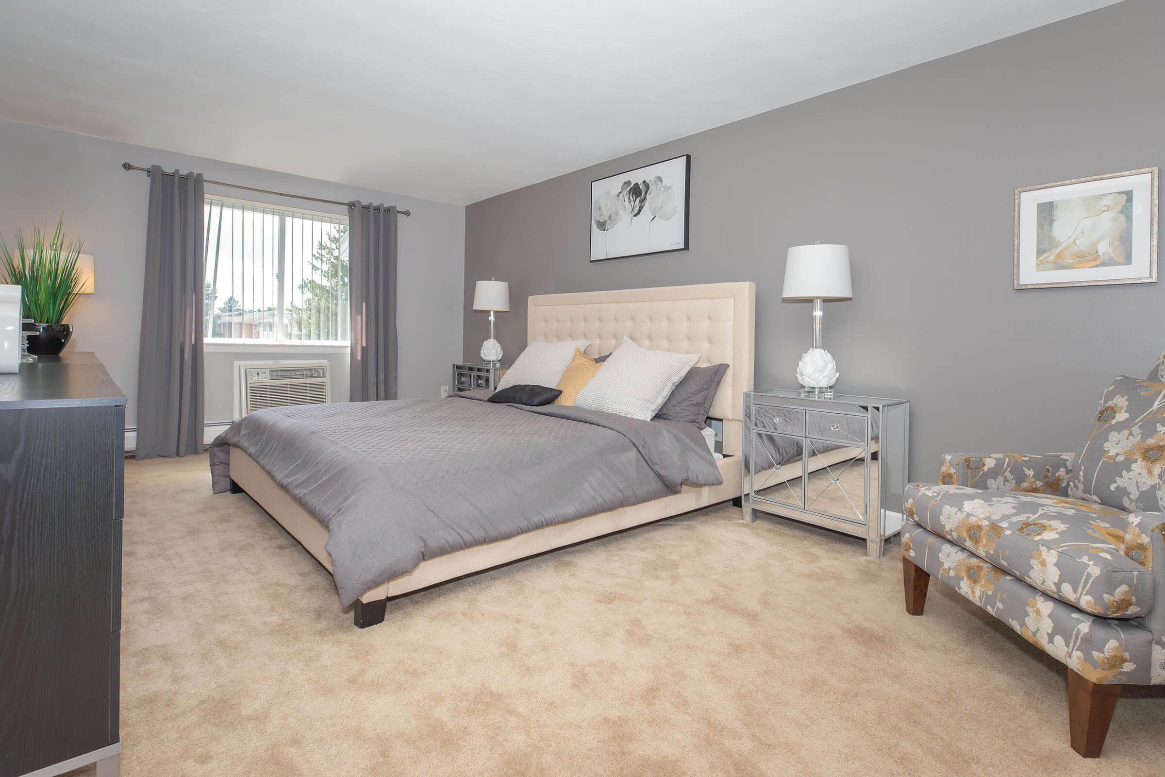 a bedroom with a large bed in a hotel room