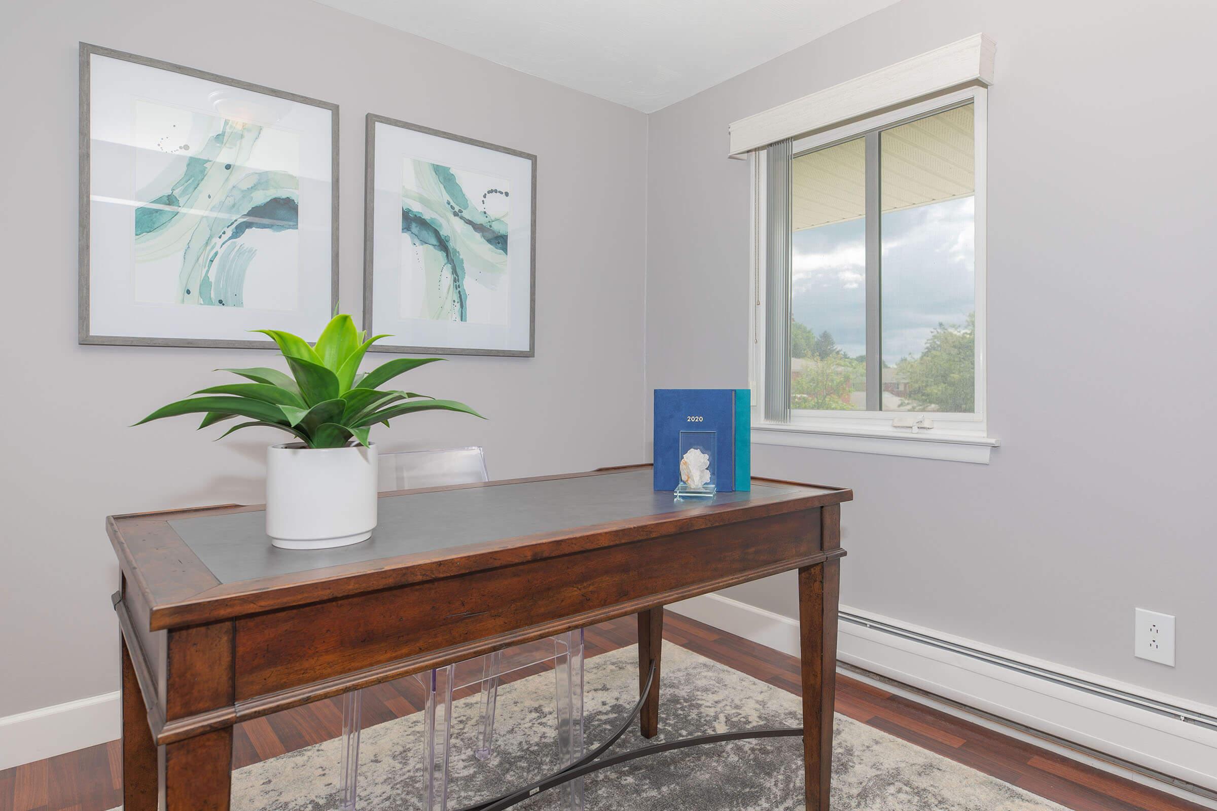 a room filled with furniture and vase on a table