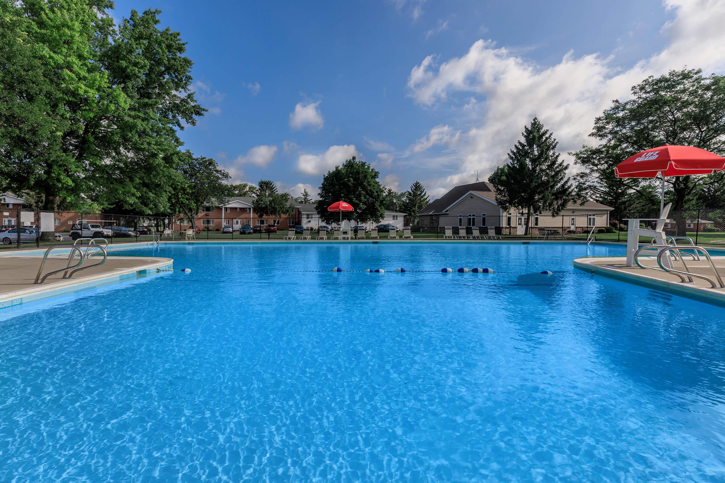 a pool next to a body of water