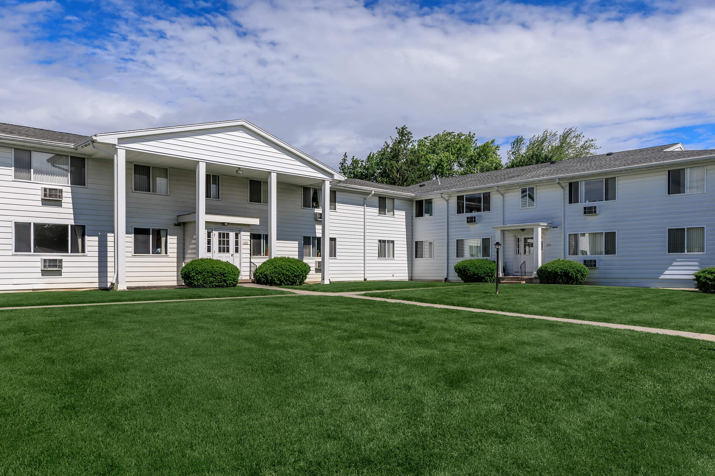 a large lawn in front of a house