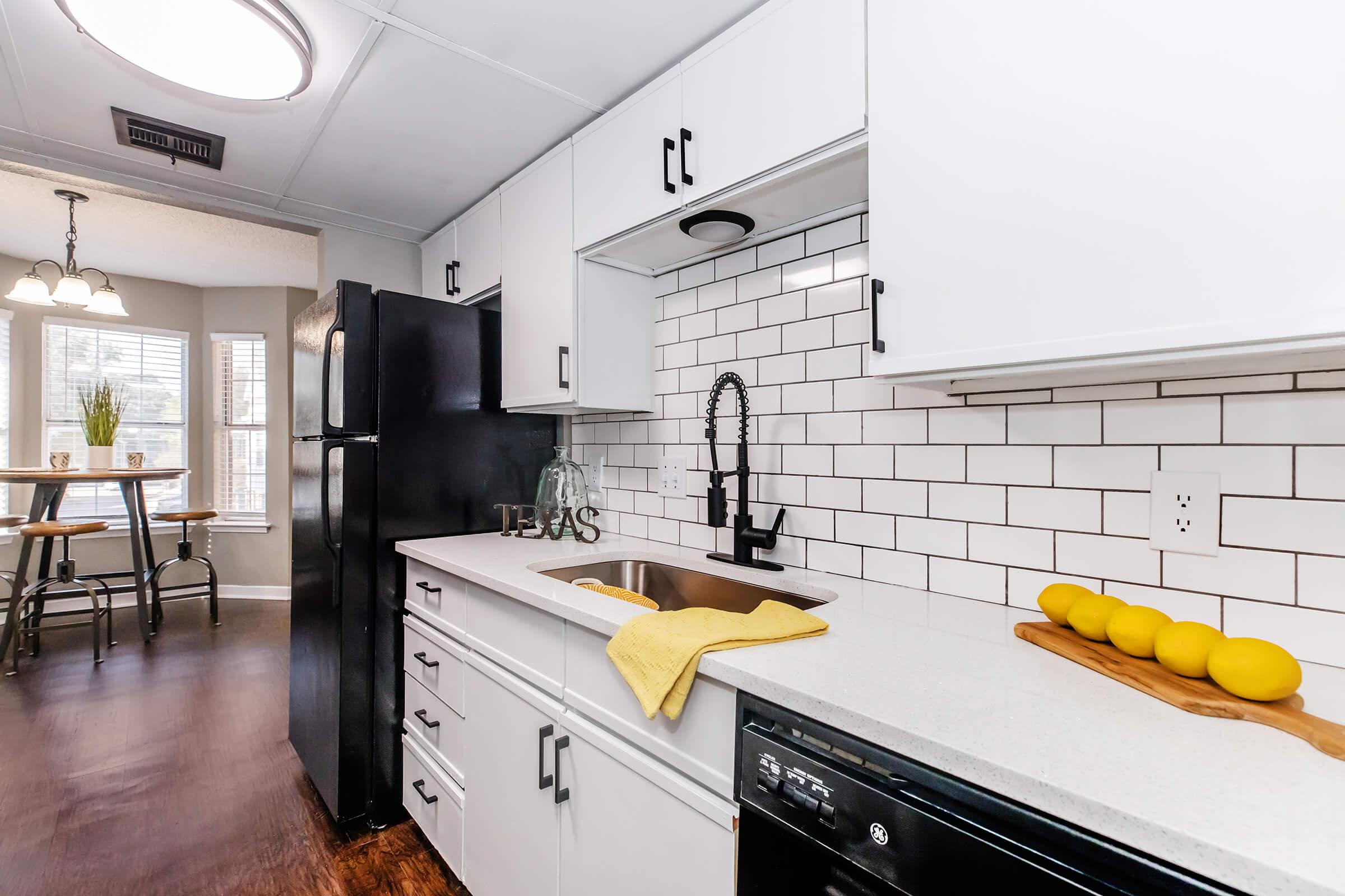 a kitchen with a table in a room