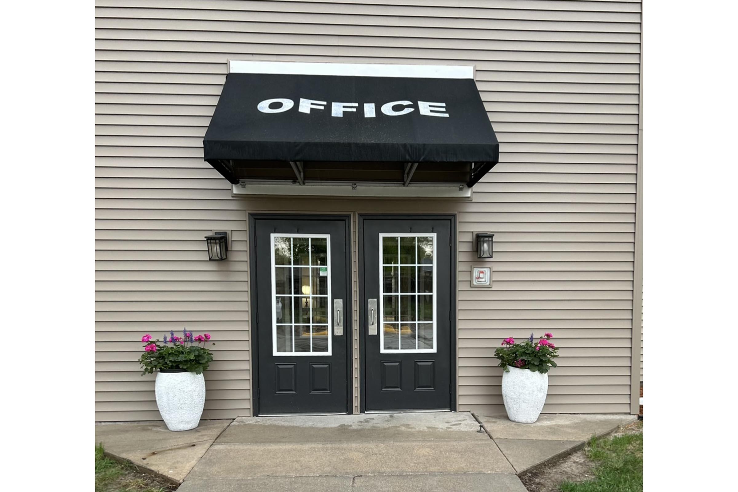 a house that has a sign on the side of a building