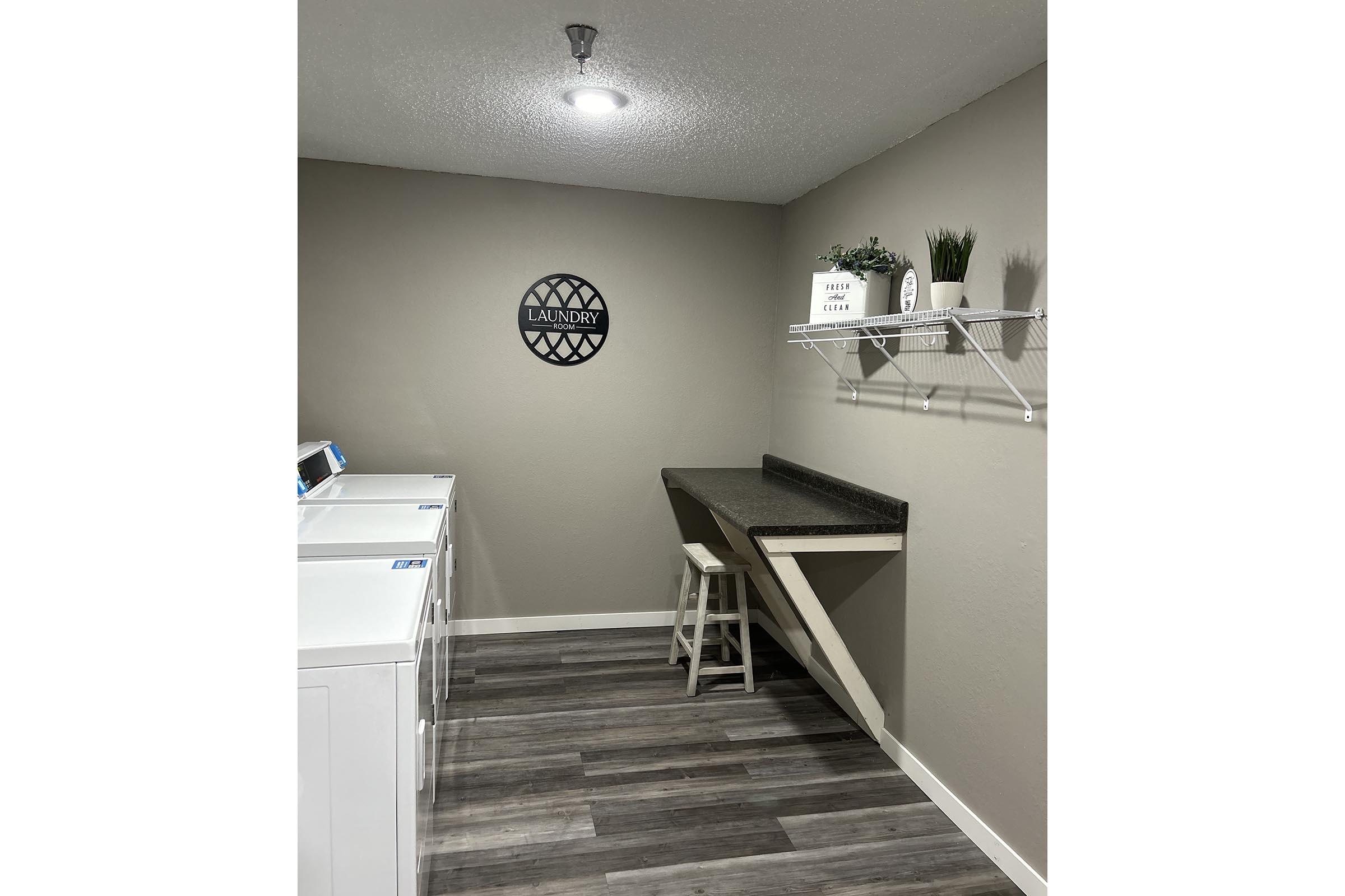 a kitchen with a sink and a mirror