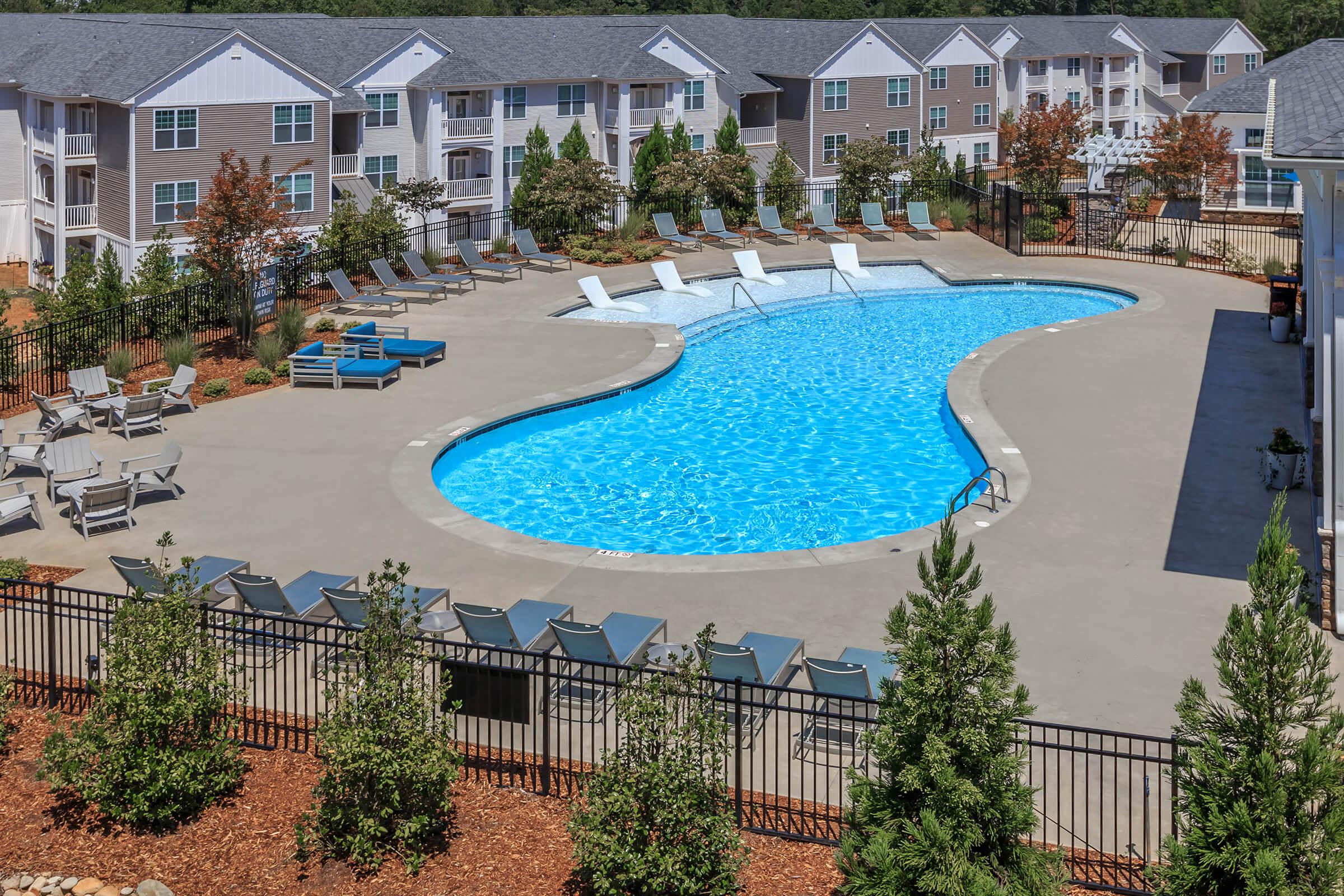 Cool Down By The Pool At Riverstone Apartments At Long Shoals In Arden, NC