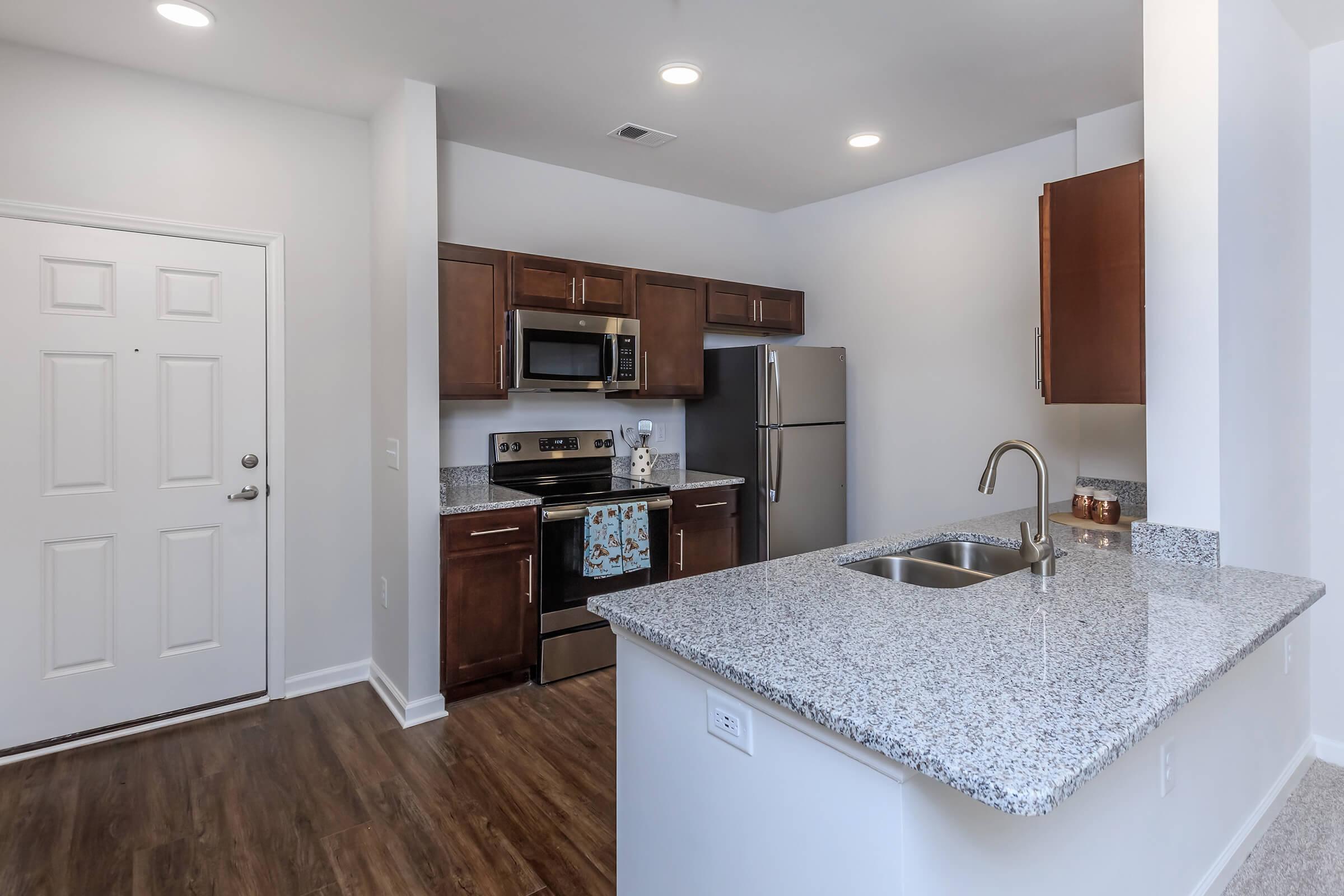 Clarendon Offers A Modern Kitchen In Riverstone Apartments At Long Shoals In Arden, NC