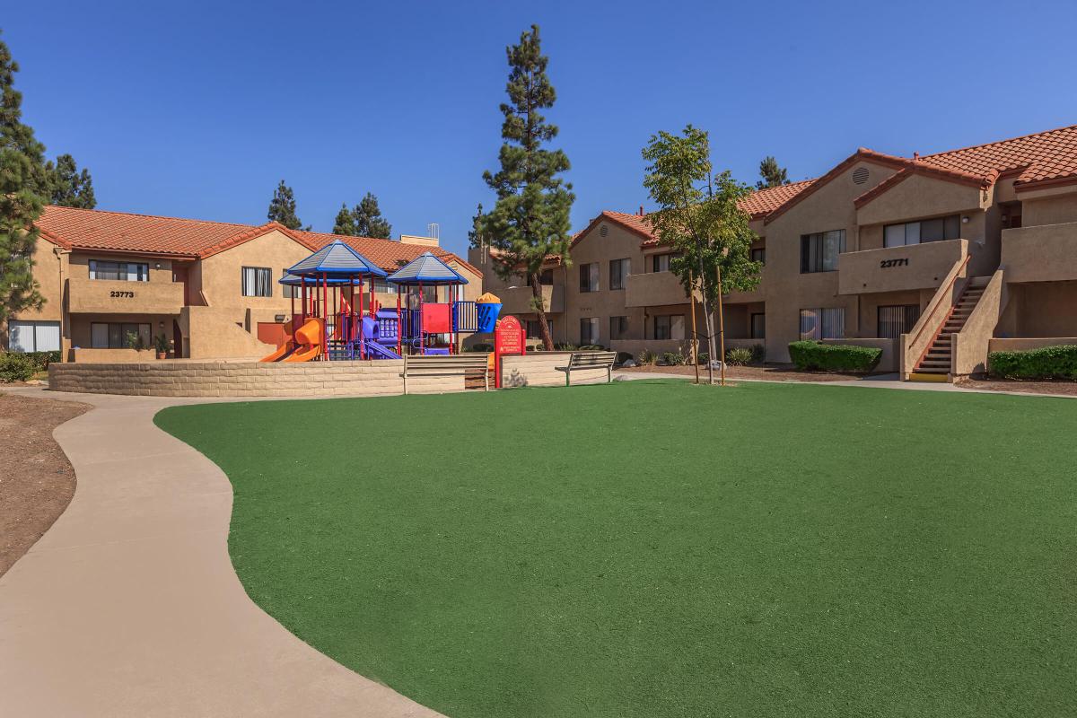 a house with a lawn in front of a building