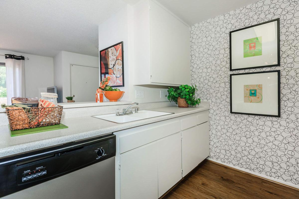 a kitchen with a sink and a refrigerator