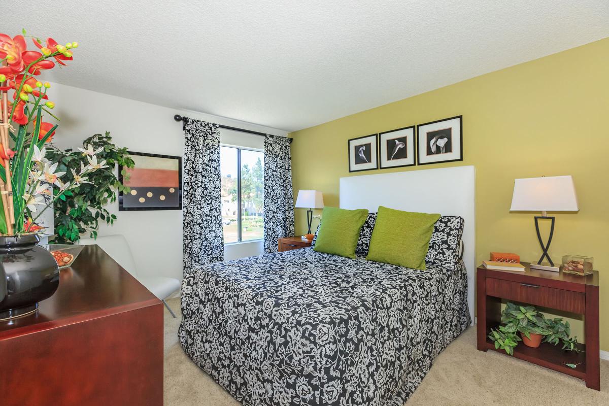 a living room filled with furniture and a flat screen tv