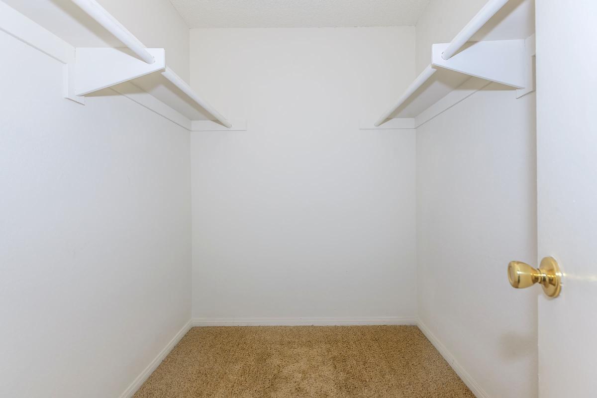 a white tub sitting next to a shower