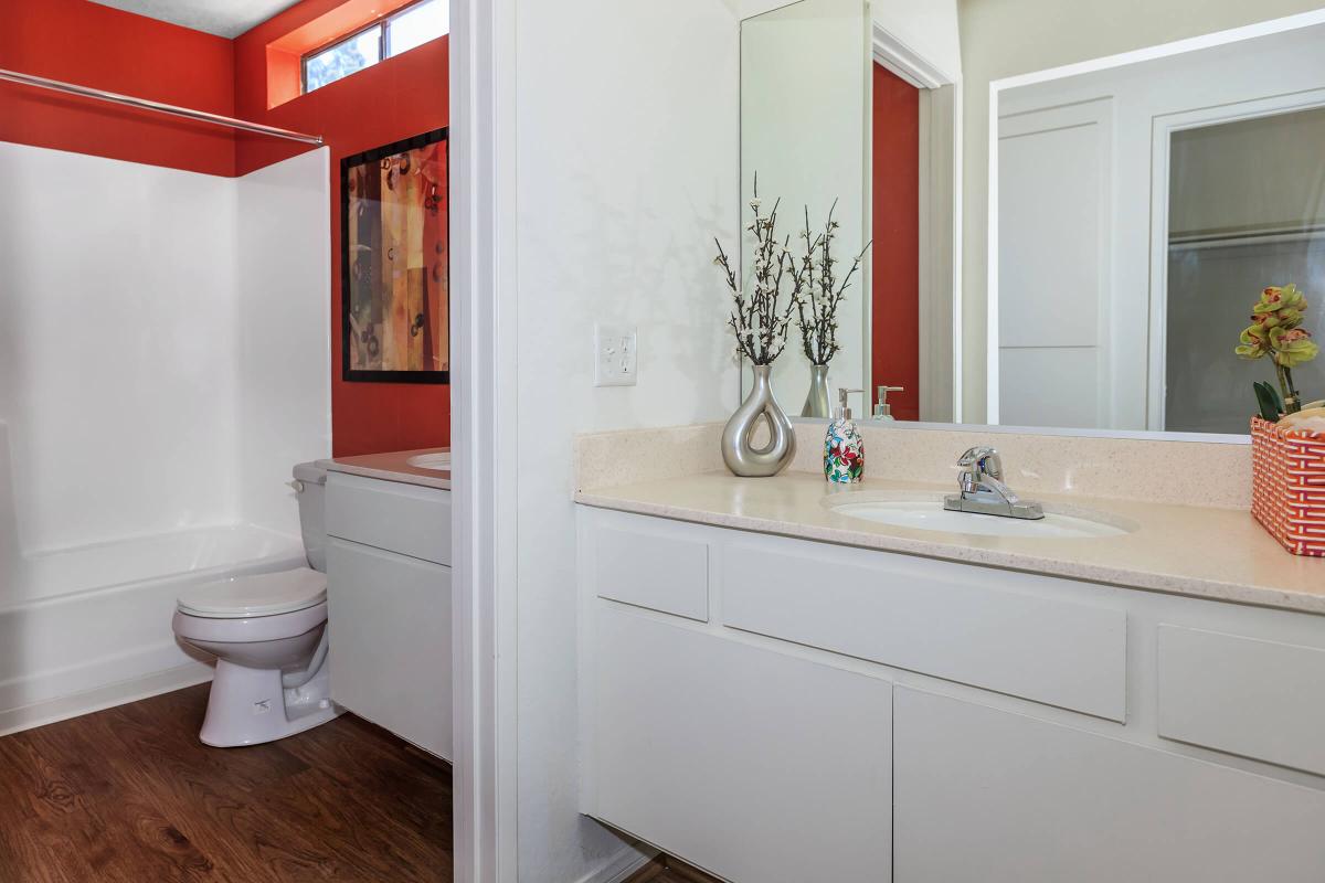 a large white tub next to a window